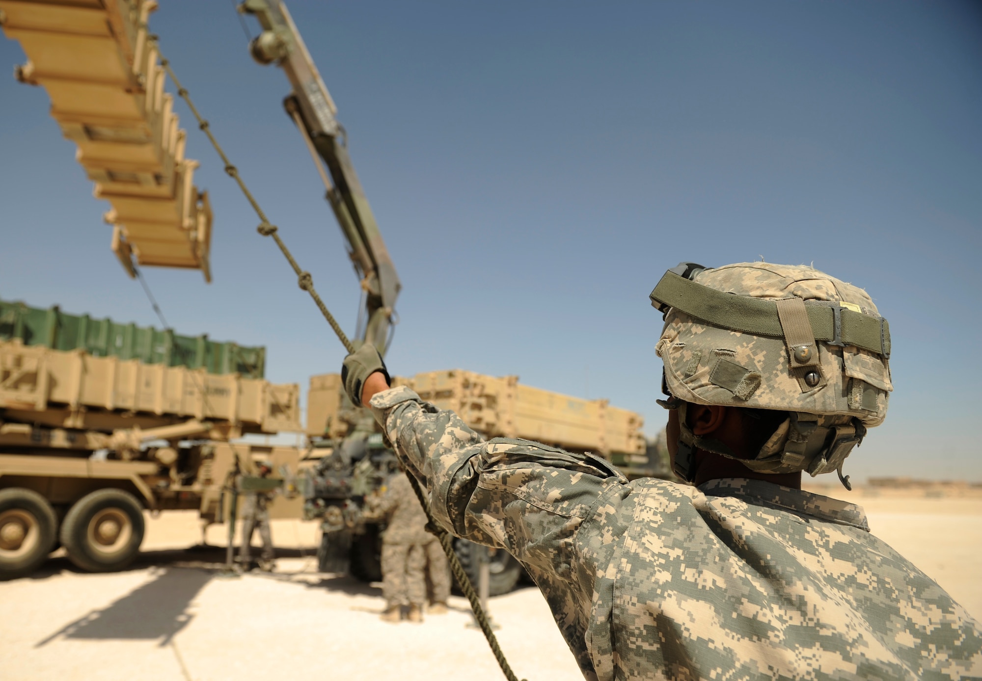 SOUTHWEST ASIA – U.S. Army Spc. Ernesto De Jesus, Bravo 5-52nd Air and Missile Defense Battery launcher station technician and native of Puerto Rico, prepares a launcher canister to lift onto a PAC-2 launcher during a crew drill here March 6, 2012. The launcher station and defense posture acts as a deterrent and an umbrella of protection for the installation and surrounding region. (U.S. Air Force photo/Staff Sgt. Nathanael Callon)