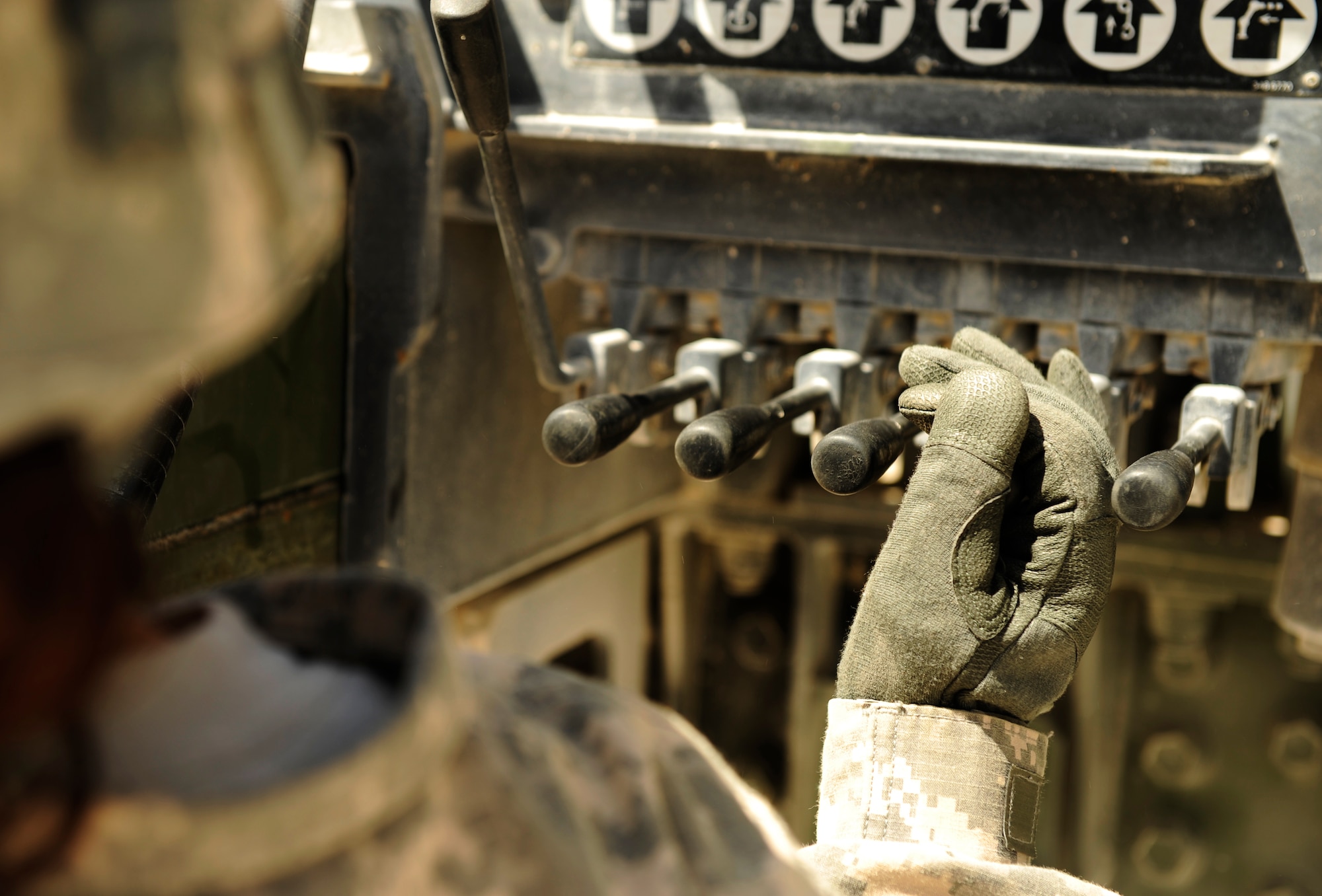 SOUTHWEST ASIA – U.S. Army Spc. Jessica Wooten, Bravo 5-52nd Air and Missile Defense Battery crane operator and native of Dallas, raises a launcher canister attached to a crane during a crew drill here March 6, 2012. The five-man crew consists of a safety NCO, two taglines who stabilize the canisters, a crane operator, and a signaler. (U.S. Air Force photo/Staff Sgt. Nathanael Callon)