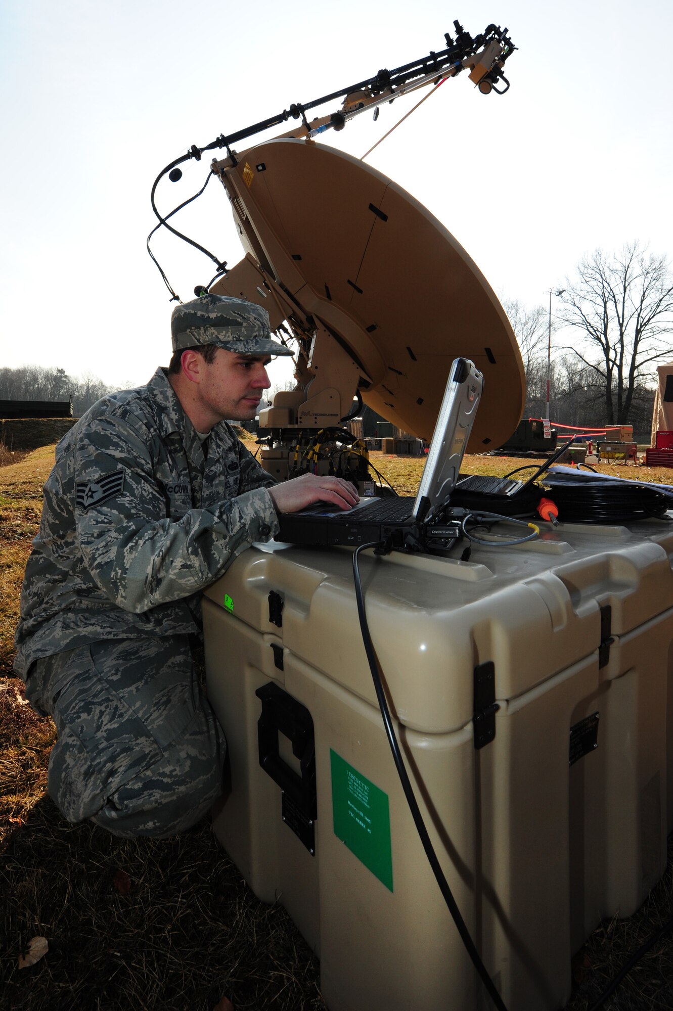 Staff Sgt. Johnny McCown, 1st Combat Communication Squadron transmission systems supervisor, configures satellite terminal, Hawkeye, during a Quick Reflex Exercise Ramstein Air Base Germany, March 09, 2012. The QRE is to test new unit type code and to familiarize Airmen apart of the 1st CCBS with what is expected from them when they are deployed. (U.S. Air Force photo/Senior Airman Aaron-Forrest Wainwright)