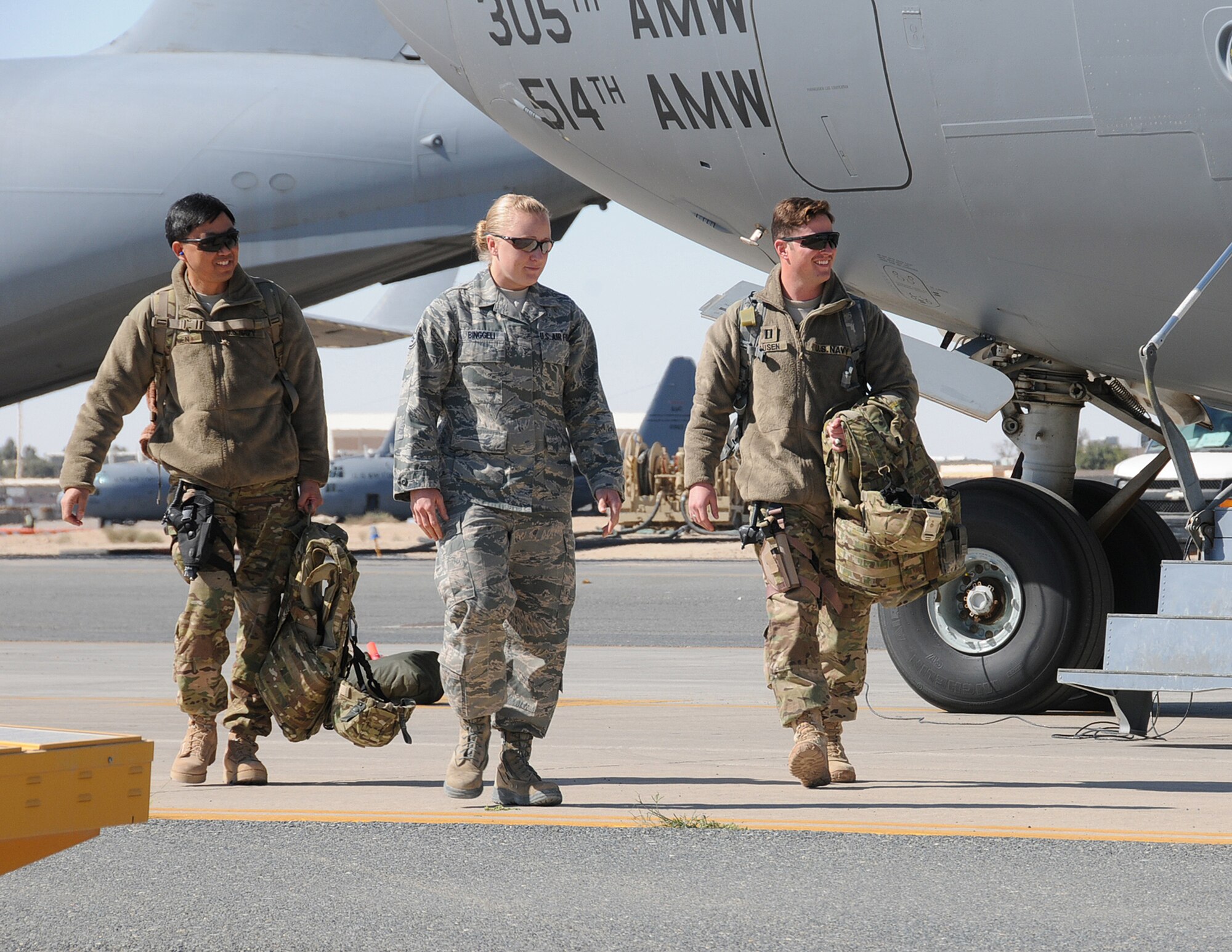 Staff Sgt. Alicia Binggeli (center), 386th Air Expeditionary Wing Protocol staff member, is the Rock Solid Warrior for March 9, 2012. She is deployed from the 421st Aircraft Maintenance Unit at Hill Air Force Base, Utah, where she works as a supply technician. (U.S Air Force photo/Staff Sgt. James Lieth/Released)