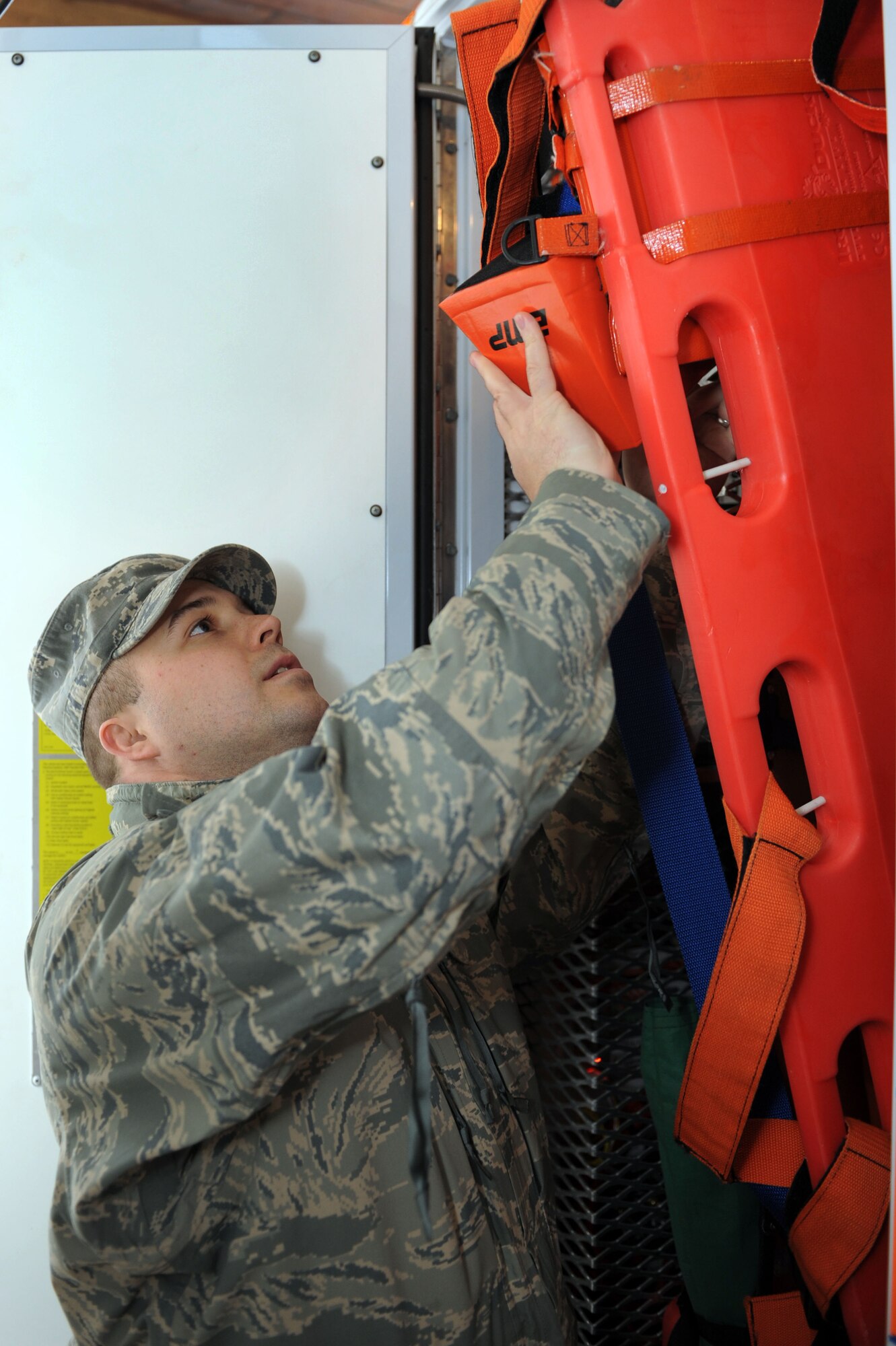 SPANGDAHLEM AIR BASE, Germany – Senior Airman Oliver Martin, 52nd Medical Operations Squadron ambulance service technician, checks the long spine boards compartment of the ambulance prior to his shift at Bldg. 137 here March 8. Function checks of all emergency equipment are conducted by technicians at the beginning of every shift. Ambulance techs provide initial medical response on Spangdahlem Air Base to support base response to in-flight and other mission related emergencies, as well as any other on-base incidents. The ambulance service provides emergency care for more than 8,400 Airmen their families and DOD civilians. (U.S. Air Force photo by Senior Airman Christopher Toon/Released)