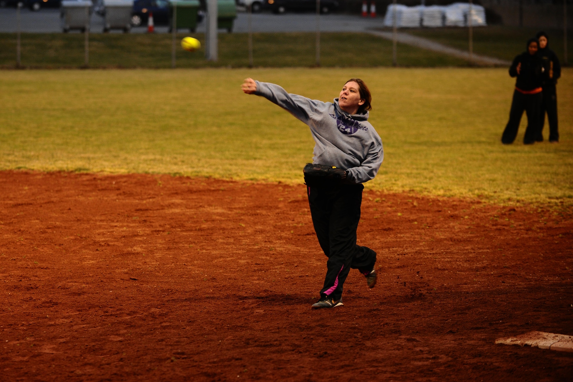 SPANGDAHLEM AIR BASE, Germany – Ali Guidry, 52nd Force Support Squadron, throws a softball to a teammate during Spangdahlem Lady Sabers varsity softball team tryouts at varsity field 1 here March 7. The softball team held tryouts until March 9. The varsity softball team competes in tournaments throughout Europe playing against other Air Force, Army and Navy teams. (U.S. Air Force photo by Airman 1st Class Matthew B. Fredericks/Released)