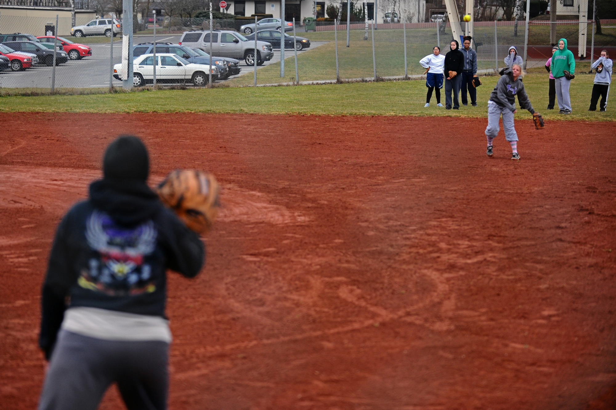 SPANGDAHLEM AIR BASE, Germany – Lyssa Dickey, 52nd Communications Squadron, throws a softballball to Kristen Curtis, 52nd Contracting Squadron, during Spangdahlem Lady Sabers varsity softball team tryouts at varsity field 1 here March 7. The softball team held tryouts until March 9. The varsity softball team competes in tournaments throughout Europe playing against other Air Force, Army and Navy teams. (U.S. Air Force photo by Airman 1st Class Matthew B. Fredericks/Released)