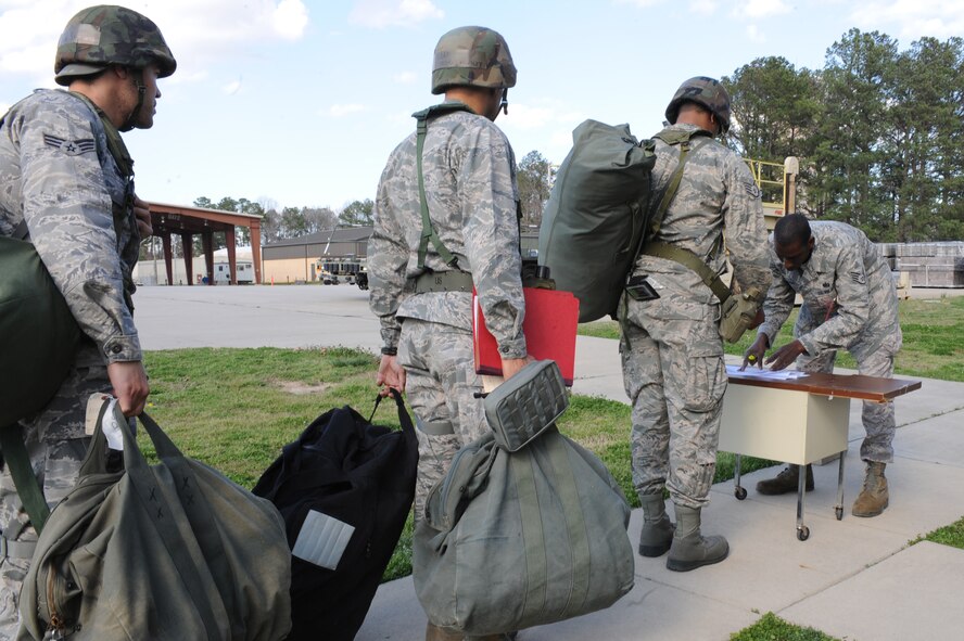 Airmen wait to in-process outside the Personnel Deployment Facility during a Phase 1 Operational Readiness Exercise at Seymour Johnson Air Force Base, N.C., Mar. 5, 2012. The ORE prepares Airmen for the Operational Readiness Inspection, which tests units on how quickly and efficiently Airmen can deploy on short notice. The PDF was able to process more than 70 Airmen in an hour. (U.S. Air Force photo/Airman 1st Class John Nieves Camacho/Released)