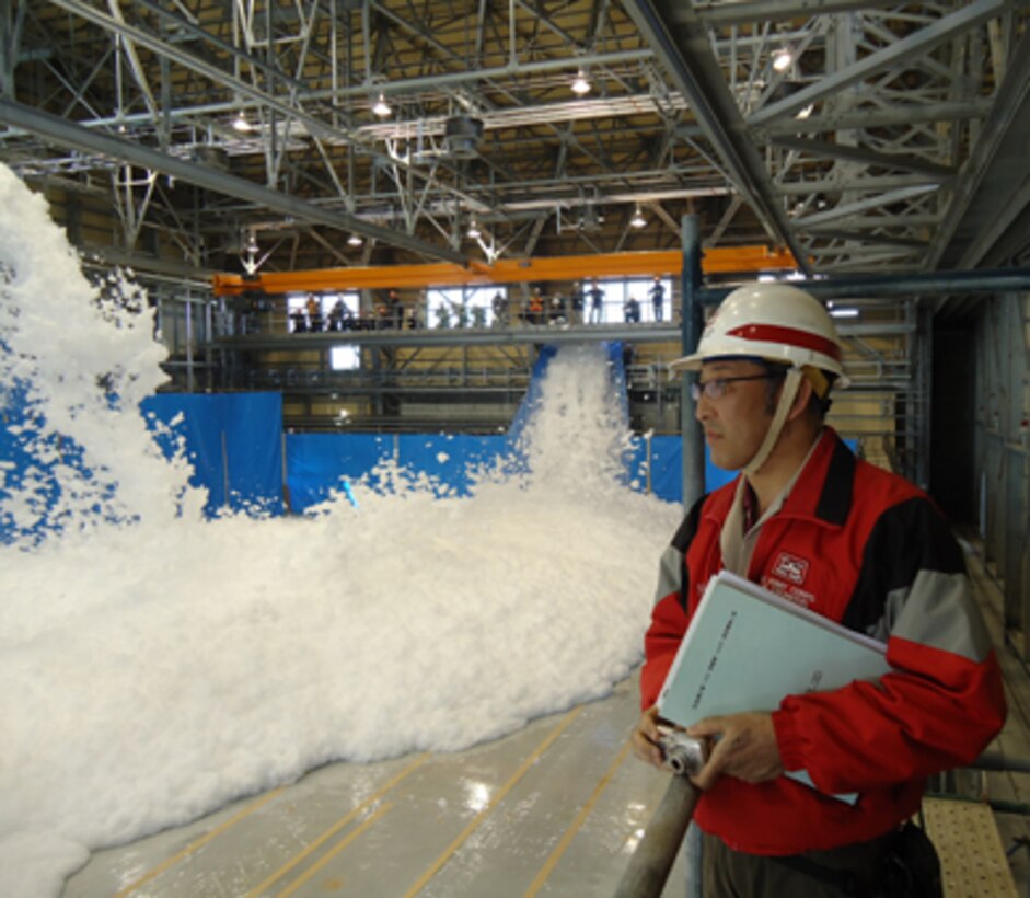 IWAKUNI, Japan - Noriyuki Mizuta, an architectural engineer at the U.S. Army 
Corps of Engineers-Japan District's Iwakuni Office, oversees the aqueous film 
forming foam discharge test for an aircraft hangar and supporting facilities.
The hangar will support Marine Aircraft Group 12 (MAG-12) aircraft which are 
currently assigned to MCAS Iwakuni. This is the first of five hangars which 
will support MAG-12 operations. The Corps' Japan District is facilitating the 
construction of the hangars in support of the U.S. Marine Corps in Japan.
