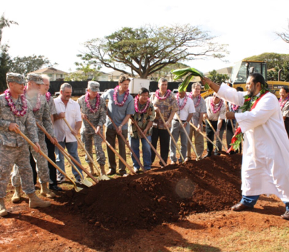SCHOFIELD BARRACKS, Hawaii - The Rev. Dr. Kaleo Patterson of the Pacific Justice and Reconciliation Center conducts the Hawaiian site blessing prior to the official ground breaking for the new 228 personnel UEPH on Montague Street. Army personnel participating in the official groundbreaking were: (left) Lt. Col. David Hurley, 25th ID Division Engineer, Lt. Col. Douglas Guttormsen, commander U.S. Army Corps of Engineers, Honolulu District (second from left) and (fifth from left) Col. Douglas Mulbury, commander, USAG-HI. The Honolulu District is committed to constructing highly-energy efficient barracks that provide Soldiers with modern accommodations, while also helping to reduce the post's energy consumption and costs.