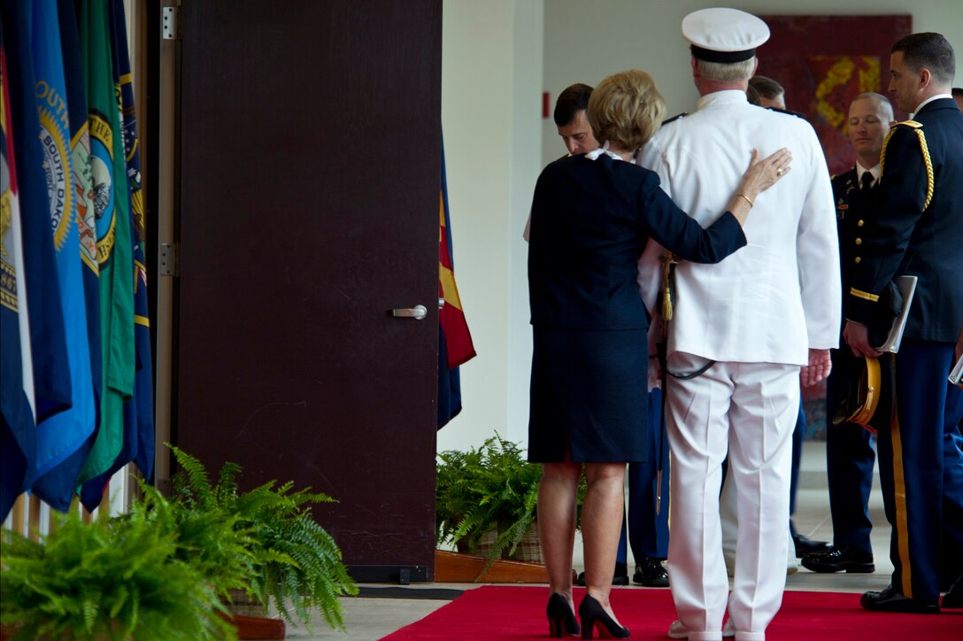 Donna Willard comforts her husband, Navy Adm. Robert F. Willard, after ...