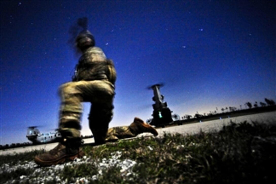 A U.S. Army soldier conducts a night raid mission during Emerald Warrior 2012, near Hattiesburg, Miss., on March 5, 2012.  The primary purpose of Emerald Warrior is to exercise special operations components in urban and irregular warfare settings to support combatant commanders in theater campaigns.  