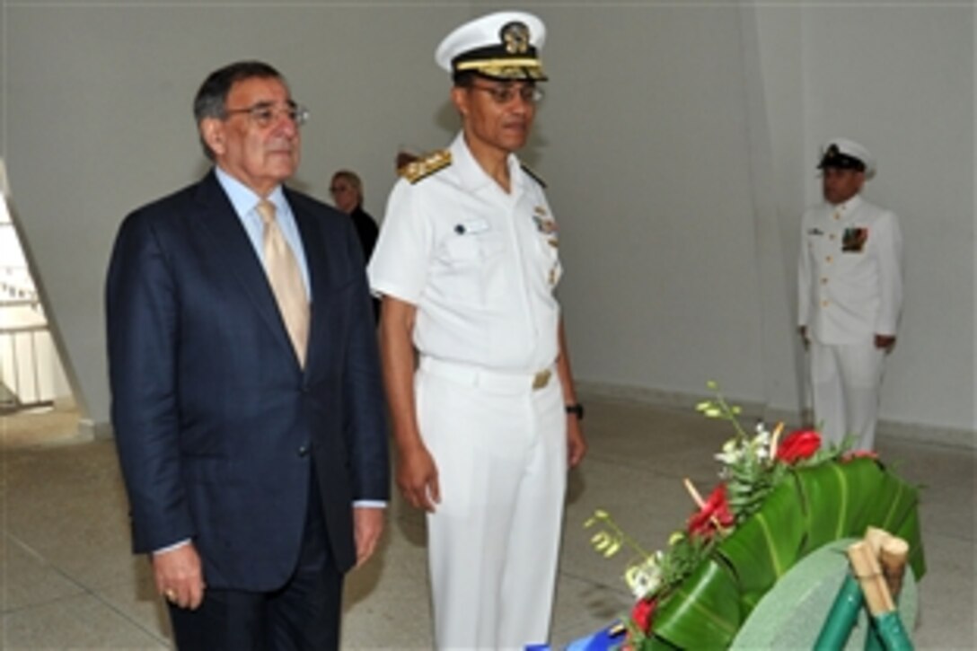 Defense Secretary Leon E. Panetta, left, and Navy Adm. Cecil D. Haney, commander of U.S. Pacific Fleet, observe a moment of silence during a wreath-laying ceremony at the USS Arizona Memorial, March 9, 2012. Panetta was in Hawaii to participate in U.S. Pacific Command's change of command ceremony. 
