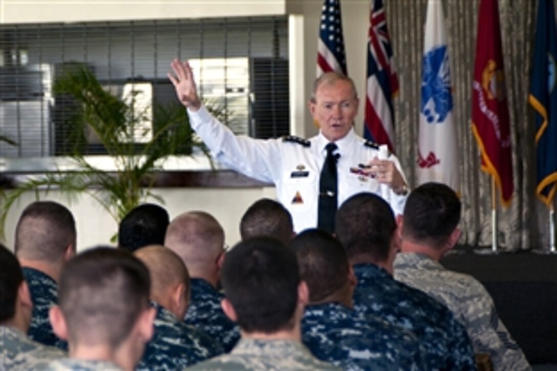 Army Gen. Martin Dempsey, chairman of the Joint Chiefs of Staff, speaks to sailors and airmen at a town hall meeting at on Joint Base Pearl Harbor-Hickam, Hawaii, March 9, 2012. The meeting enabled service members to personally ask Dempsey questions concerning current events. 