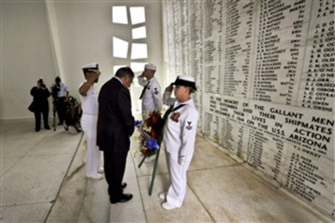 Defense Secretary Leon E. Panetta observes a a moment of silence as he visits the USS Arizona Memorial in Pearl Harbor, Hawaii, March 9, 2012. Panetta was in Hawaii to attend a change-of-command ceremony for U.S. Pacific Command.