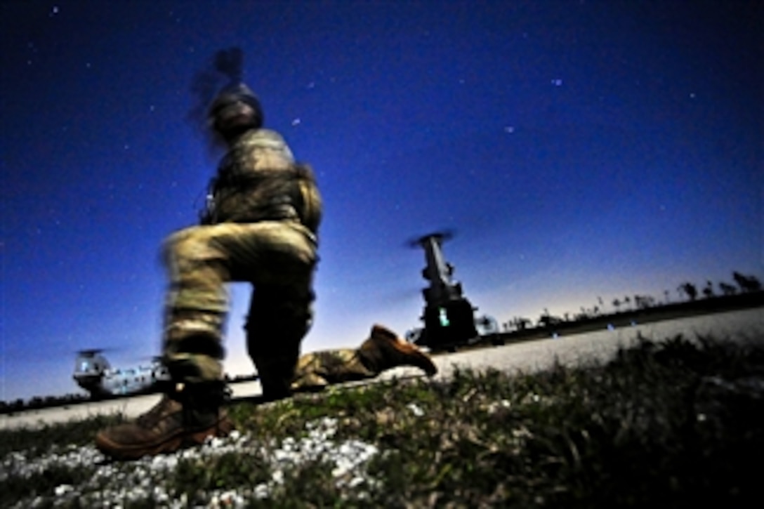 A U.S. Army soldier conducts a night raid mission during Emerald Warrior 2012, near Hattiesburg, Miss., on March 5, 2012.  The primary purpose of Emerald Warrior is to exercise special operations components in urban and irregular warfare settings to support combatant commanders in theater campaigns.  