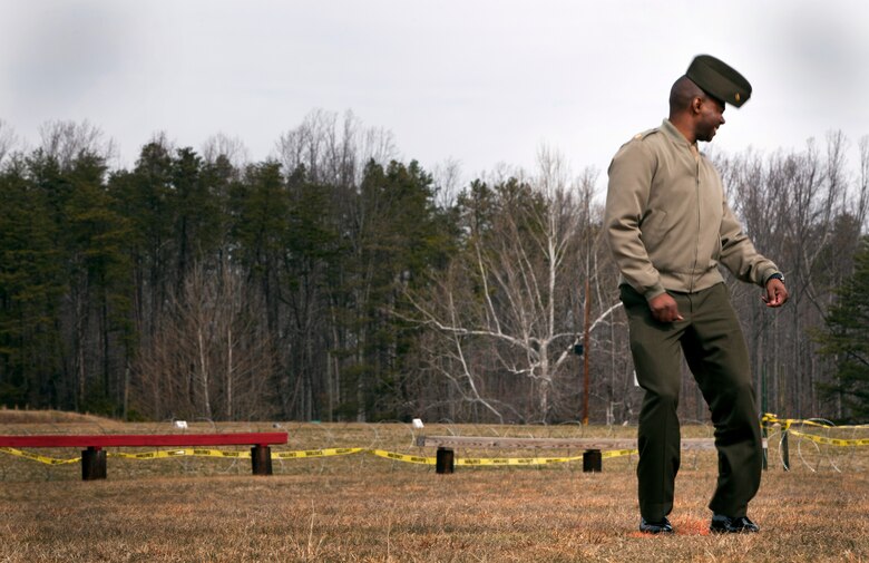 Maj. Vannie L. Coles with the Bureau of Political-Military Affairs reacts to a wave of hot air from the Active Denial System during a demonstration at Marine Corps Base Quantico, Va., March 9. The ADS is a non-lethal weapon that projects a long range, man-sized beam of millimeter waves that produce a reversible heating sensation to the skin, much like opening a hot oven. It is one of many non-lethal weapons the Marine Corps is looking to deploy into combat zones to minimize casualties and collateral damage. It can be used for perimeter defense, crowd control and area denial against any human threat.