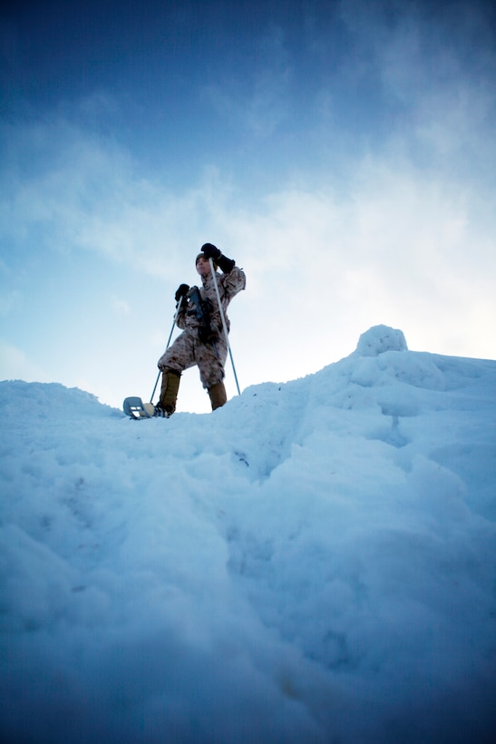 A Marine with Company K, 3rd Battalion, 24th Marine Regiment, 4th Marine Division, practices walking with snowshoes at the Allied Training Center here, March 9. Company K was in Norway March 4-24 for Exercise Cold Response 2012. The multinational invitational event focused on rehearsing conventional-warfare operations in winter conditions and exercising interoperability with the NATO allies. (U.S. Marine Corps photo by Lance Cpl. Marcin Platek)