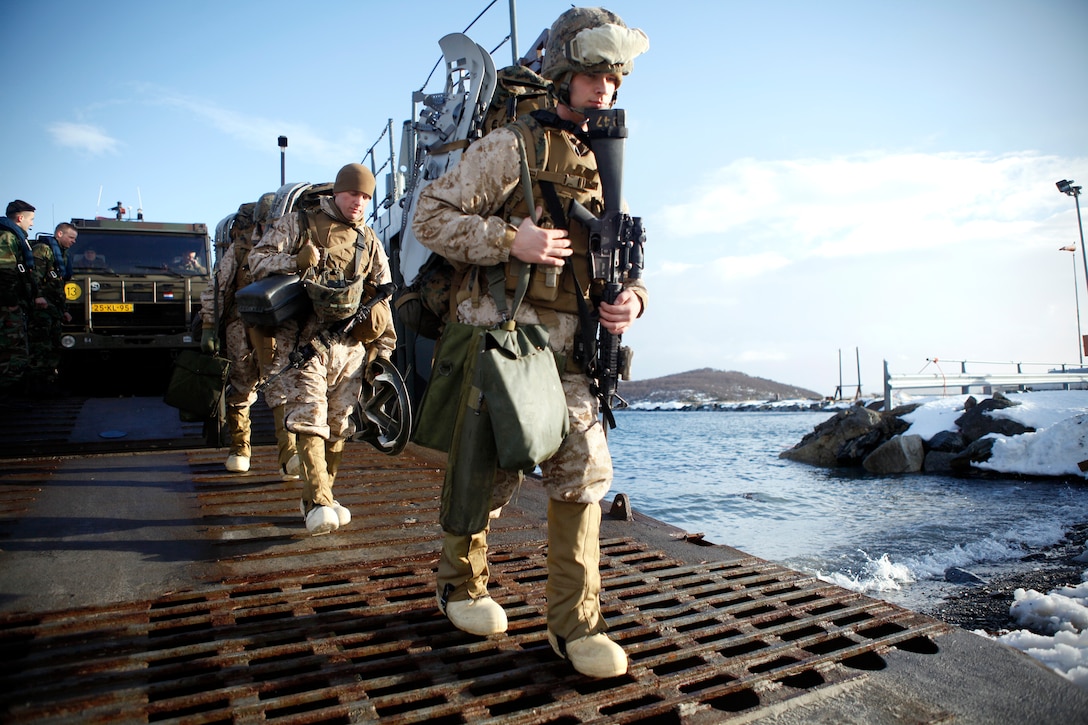 Marines with Company K, 3rd Battalion, 24th Marine Regiment, 4th Marine Division, debark a Dutch landing craft utility, March 9. The LCU carried them from Her Netherlands Majesty's Ship Rotterdam. Company K was in Norway March 4-24 for Exercise Cold Response 2012. The multinational invitational event focused on rehearsing conventional-warfare operations in winter conditions and exercising interoperability with the NATO allies. (U.S. Marine Corps photo by Lance Cpl. Marcin Platek)