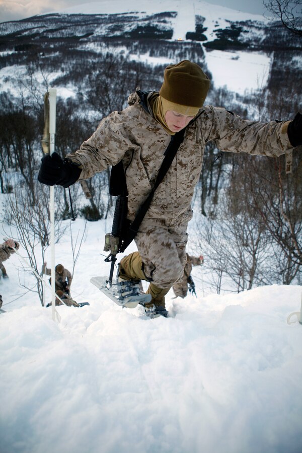 Sgt. Ryan H. Wright, squad leader for 3rd Platoon, Company K, 3rd Battalion, 24th Marine Regiment, 4th Marine Division, and a St. Louis native, practices walking uphill in snowshoes at the Allied Training Center here, March 9. Company K was in Norway March 4-24 for Exercise Cold Response 2012. The multinational invitational event focused on rehearsing conventional-warfare operations in winter conditions and exercising interoperability with the NATO allies. (U.S. Marine Corps photo by Lance Cpl. Marcin Platek)