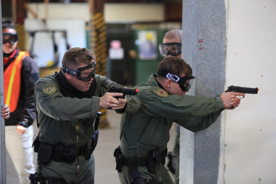 Marines with Camp Pendleton's Special Reaction Team participate in an active shooter exercise at a warehouse reconstructed for tactical maneuvering and training exercises on Marine Corps Base Camp Pendleton, Calif., March 9. Marine Corps Police Academy hosted the Active Shooter Training Program that simulated shooting scenarios to further enhance the effectiveness of Camp Pendleton's security forces.