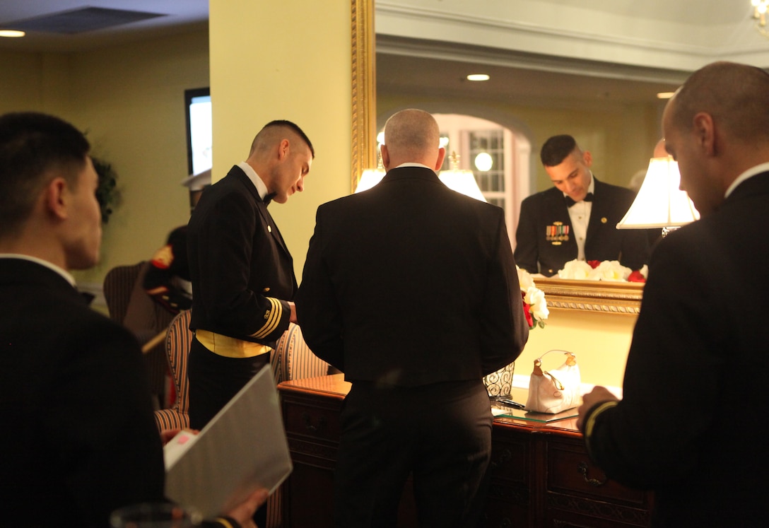 Navy Cmdr. Marc R. Delao, commanding officer, Officer in Charge of Construction, Marine Corps Instillation East, prepares for the Seabee ball at Marine Corps Base Camp Lejeune. Delao hosted the evening's festivities at the Paradise Point Officers’ Club aboard MCB Camp Lejeune.