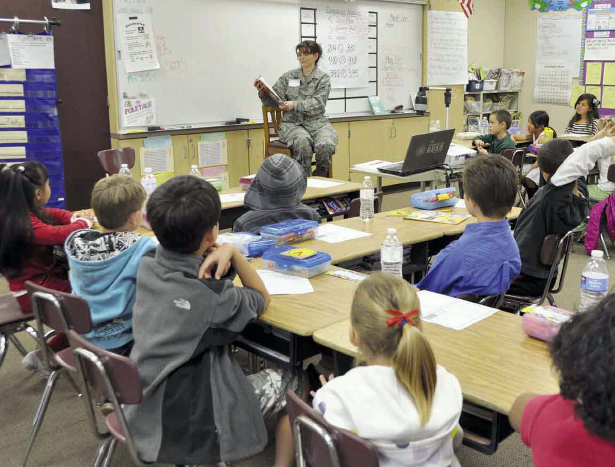 Senior Master Sgt. Tammy Haro, 752 Medical Squadron, reads the Dr. Seuss’ book Horton Hears a Who to students at John F. Kennedy Elementary School in Riverside, Calif., Friday, March 2, as part of the National Read Across America Day to celebrate the author’s birthday. Haro and other Team March members volunteered to read at various schools throughout the area. (U.S. Air Force photo by Megan Crusher)

