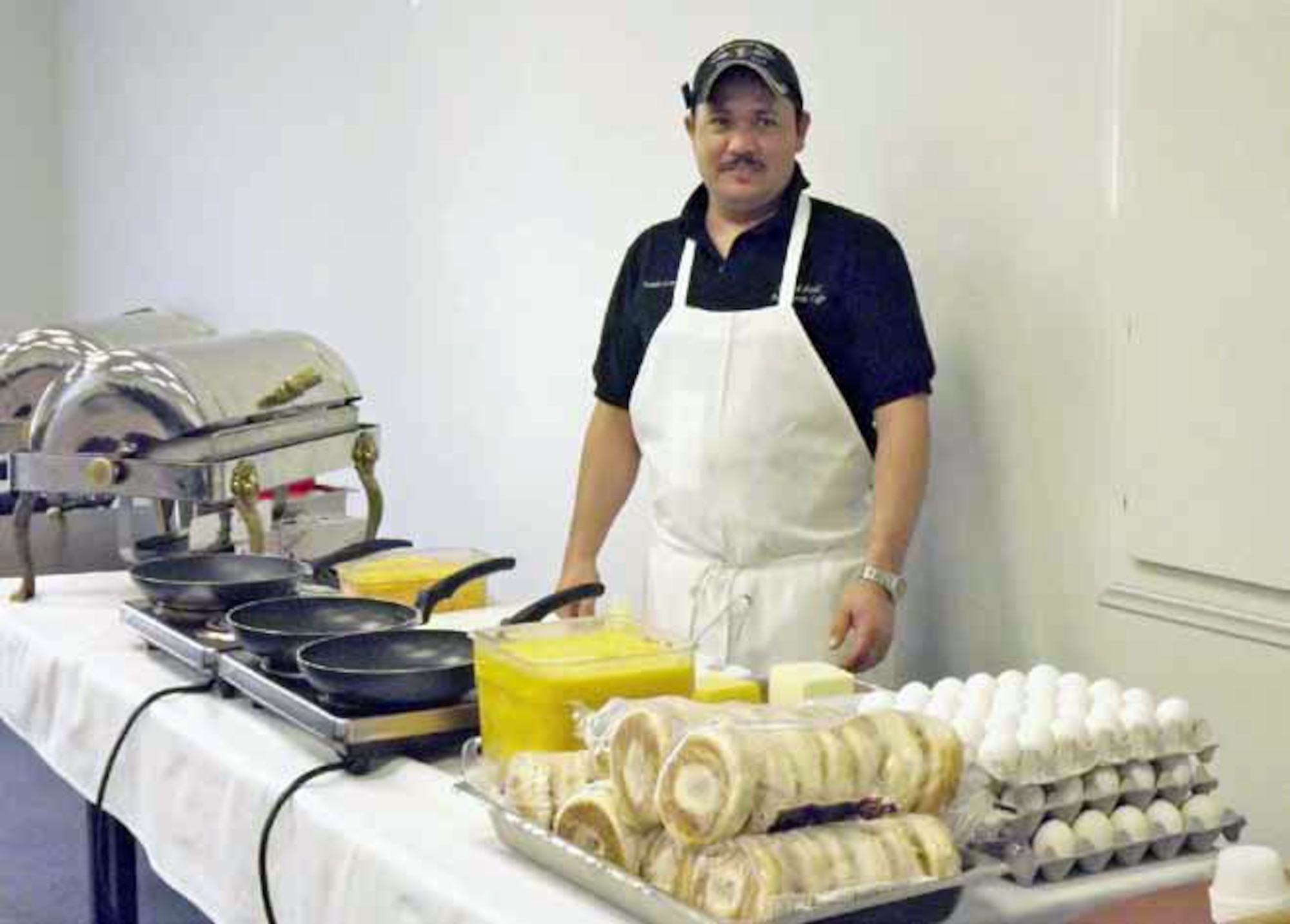 Octavio Gomez-Magdaleno, BackStreet Café cook, is ready to prepare breakfast orders for the March Inn staff during their Employee Appreciation Day breakfast March 2. Management provided the breakfast as a way to say thank you to its staff for their hard work. (U.S. Air Force photo by Michelle Converse)