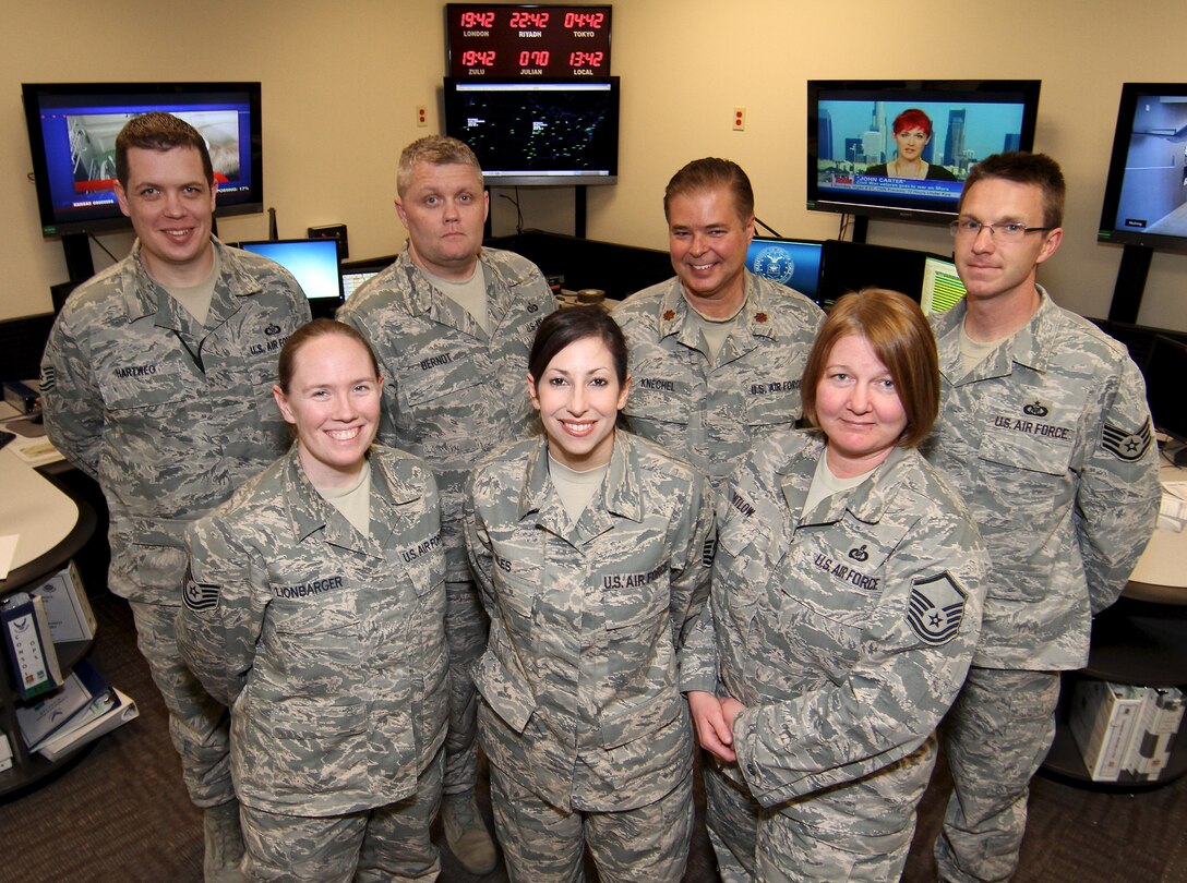 Members of the 932nd Airlift Wing Command Post are all smiles for being named the Best Small Wing Command Post in 4th Air Force.  From left, front row are: Tech. Sgt. Dawn Lionbarger, Master Sgts. Tracy Jiles and Rachel Whitlow. Back row, from left: Tech. Sgt. Matthew Hartweg, Staff Sgt. Darin Berndt, Maj. Timothy Knechel and Tech. Sgt. Larry Marsh.  (U.S. Air Force photo/Tech. Sgt. Christopher Parr) 