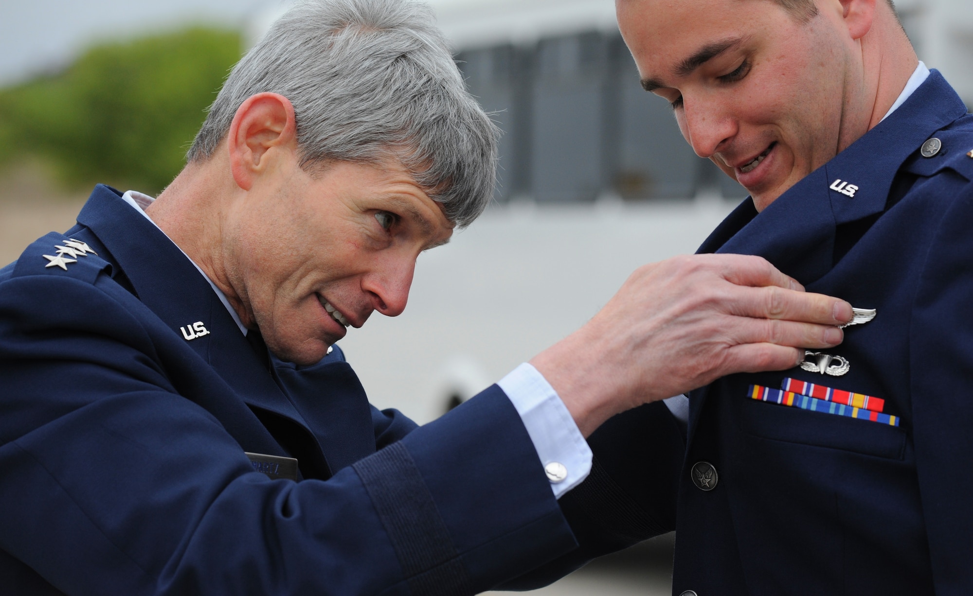LAUGHLIN AIR FORCE BASE, Texas— Air Force Chief of Staff Gen. Norton Schwartz pins wings on one of the Air Force’s newest pilots here March 9 after the graduation of Specialized Undergraduate Pilot Training Class 12-06. Twenty three of the newest professional aviators were awarded silver wings during the ceremony. (U.S. Air Force photo/Airman 1st Class Nathan L. Maysonet)