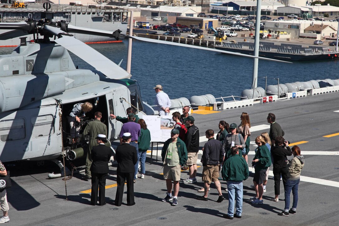 Members of the Carter Center learn about the UH-1Y helicopter during a visit to the USS Peleliu Mar. 10. The visitors flew from all parts of the U.S. for the Carter Center Winter Weekend and were able to see firsthand the USS Peleliu and learn about the capabilities of the 15th Marine Expeditionary Unit.