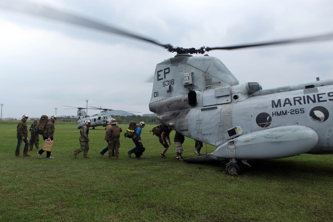 Evacuees are loaded onto CH-46E Sea Knight helicopters by Marines of Combat Logistics Battalion 31, 31st Marine Expeditionary Unit, during a mock noncombatant evacuation operation, March 11. The NEO was conducted during the MEU’s Certification Exercise in preparation for the upcoming deployment to the Asia-Pacific region. The 31st MEU is the only continuously forward-deployed MEU and remains the nation’s force in readiness in the Asia-Pacific region.