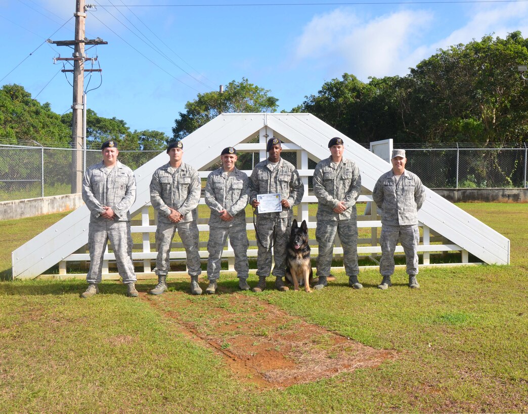 Staff Sgt. Jauvarie Lewis, 36th Security Forces Squadron military
working dog handler, was awarded Team Andersen's Best here, March 1.
Andersen's Best is a recognition program which highlights a top performer
from the 36th Wing. Each week, supervisors nominate a member of their team
for outstanding performance and the wing commander presents the selected
Airman/Civilian with an award.  (U.S. Air Force photo/ Senior Airman
Veronica McMahon)
