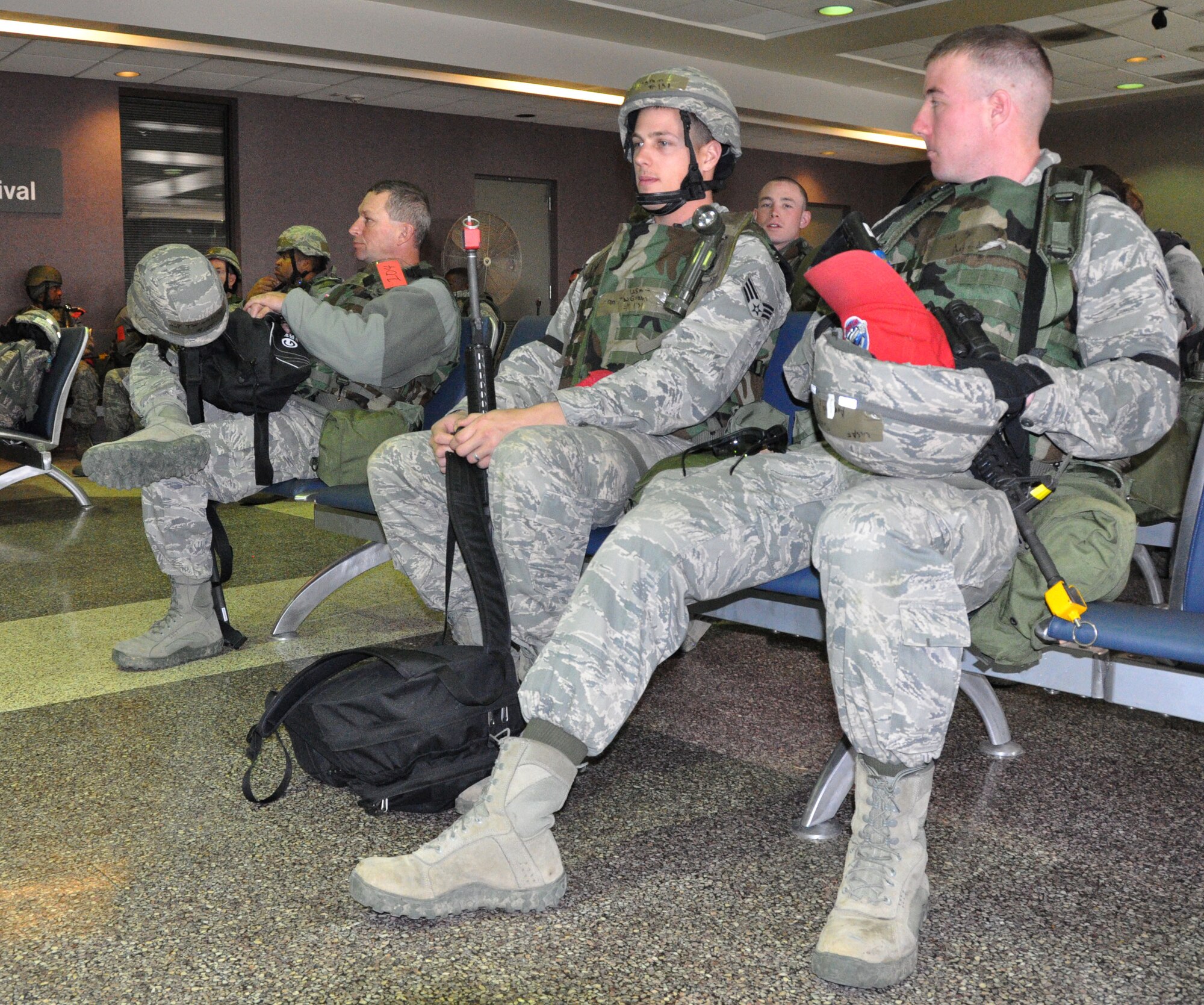 Airmen from the 560th Red Horse Squadron relax at the passenger terminal March 11, 2012 at Joint Base Charleston, S.C. after completing a four day operational readiness exercise at the North Carolina Air National Guard’s 145th Regional Training Site in New London, N.C. The exercise gave Charleston Airmen the opportunity to utilize their airbase readiness skills and prepared them for potential real world events and deployments. (U.S. Air Force photo/Staff Sgt. Shane Ellis)