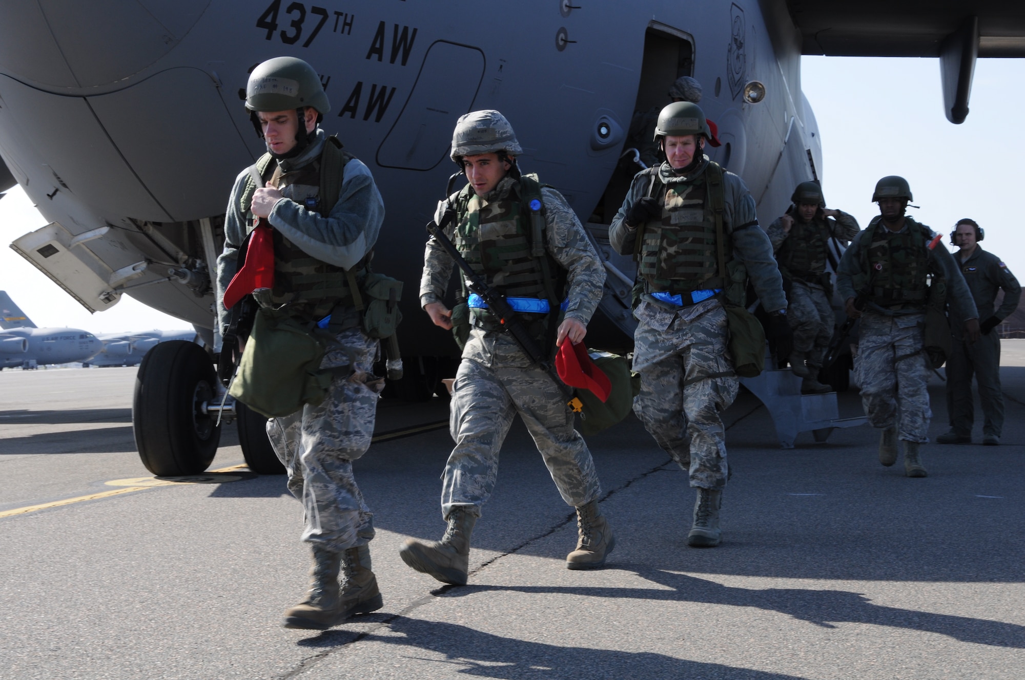 Airmen from the 560th Red Horse Squadron exit a C-17 Globemaster III March 11, 2012 at Joint Base Charleston, S.C. after completing a four day operational readiness exercise at the North Carolina Air National Guard’s 145th Regional Training Site in New London, N.C. The exercise gave Charleston Airmen the opportunity to utilize their airbase readiness skills and prepared them for potential real world events and deployments. (U.S. Air Force photo/Staff Sgt. Shane Ellis)