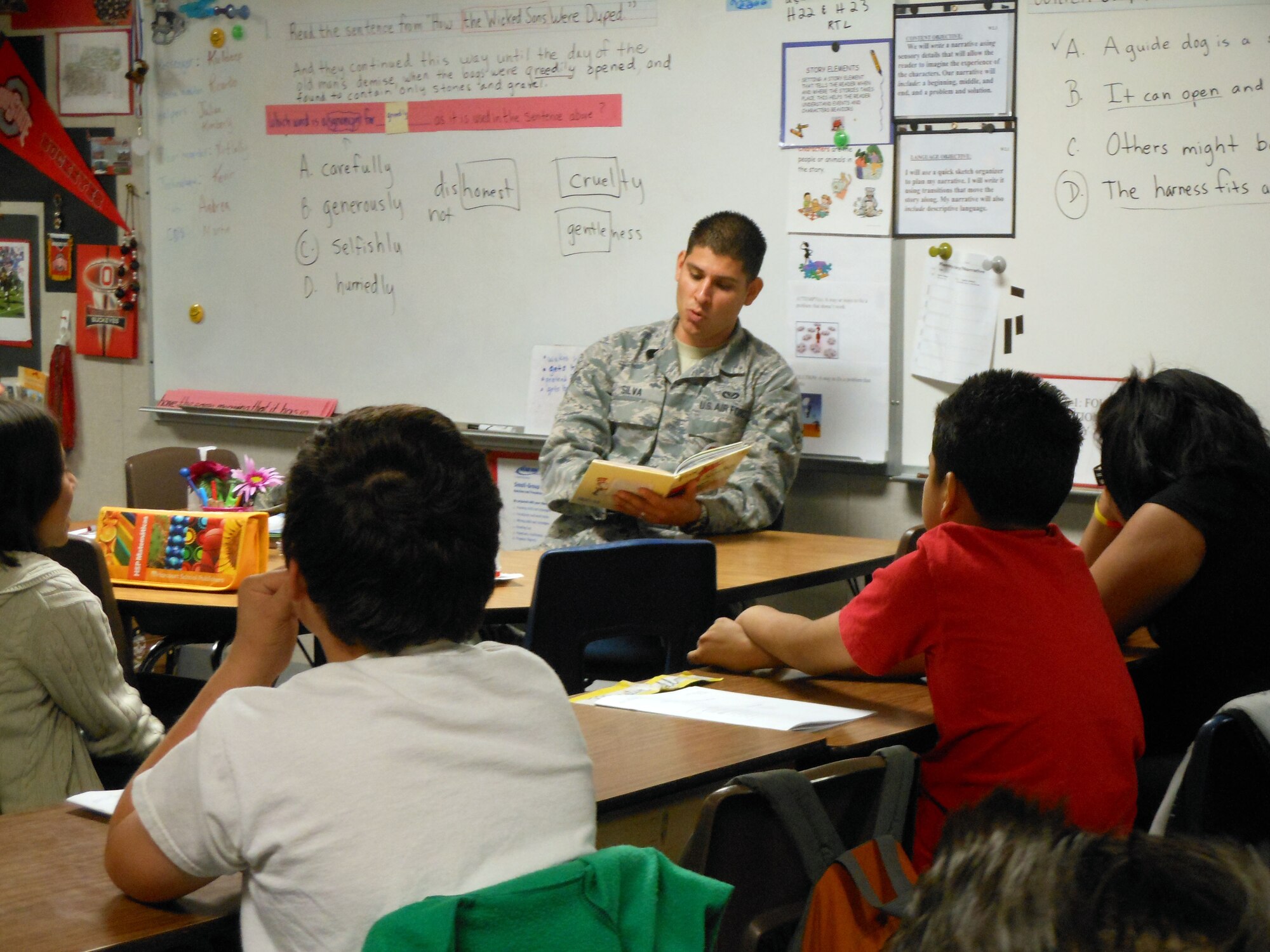 Senior Airman Manuel Silva, from the 452 Aeromedical Evacuation Squadron, reads to students at the Foothill Elementary School on March 2nd.

