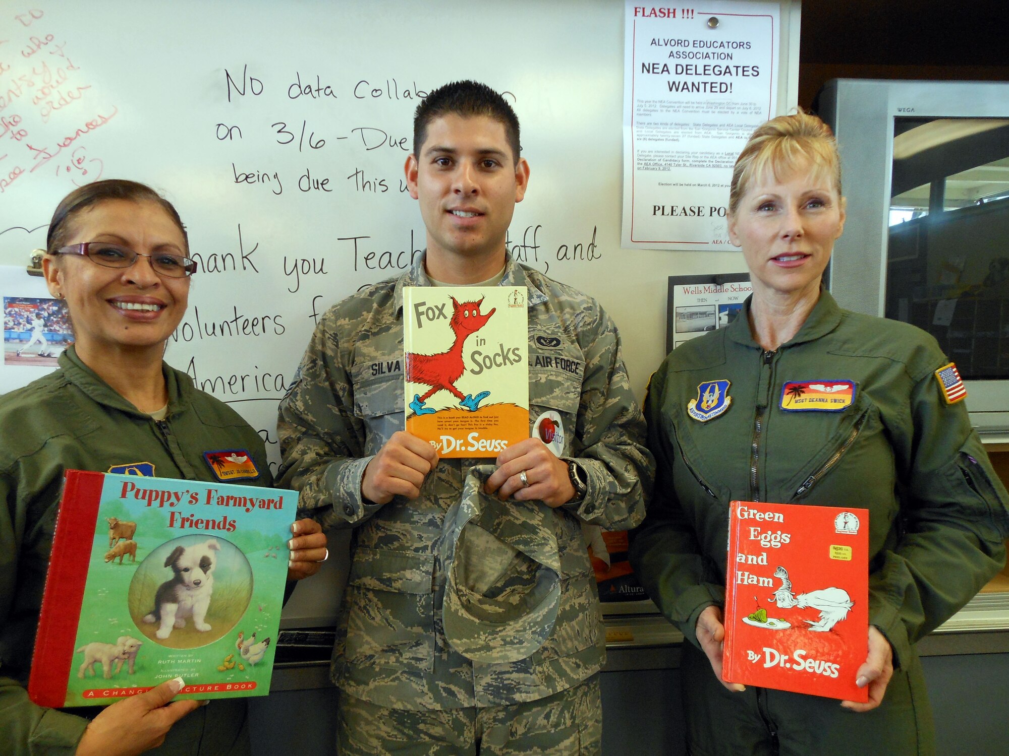 Master Sgt. Deanna Swick, Senior Airman Manuel Silva and Senior Master Sgt. Jo Carrillo. all from the 452 Aeromedical Evacuation  Squadron, read to students at the Foothill Elementary School on March 2nd. (U.S. Air Force courtesy photo)

