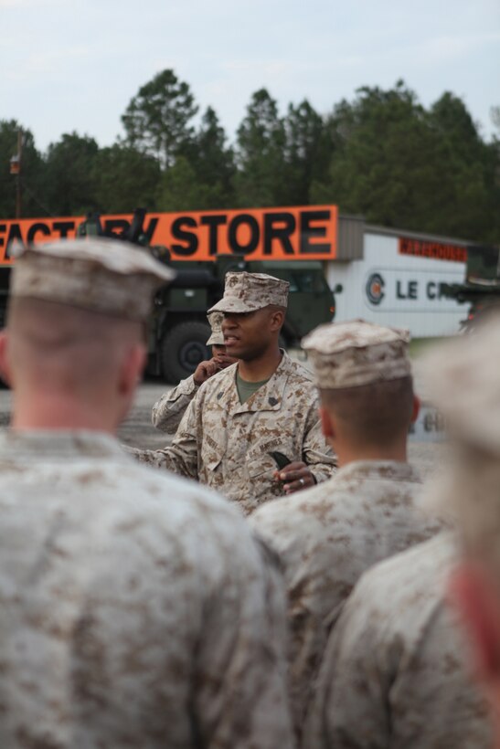 Gunnery Sgt. Imhotep Woodby, the operations chief with Alpha Company, Combat Logistics Battalion 8, 2nd Marine Logistics Group, talks to Marines and sailors during a long-range convoy at a stop in Beaufort, S.C., March 12, 2012.  The troops drove more than 1,000 miles during a six-day exercise in order to test the battalion’s mission essential tasks, which consisted of basic warrior skills, recovery procedures, distribution and repairs, as well as evacuation techniques and motor vehicle operations.