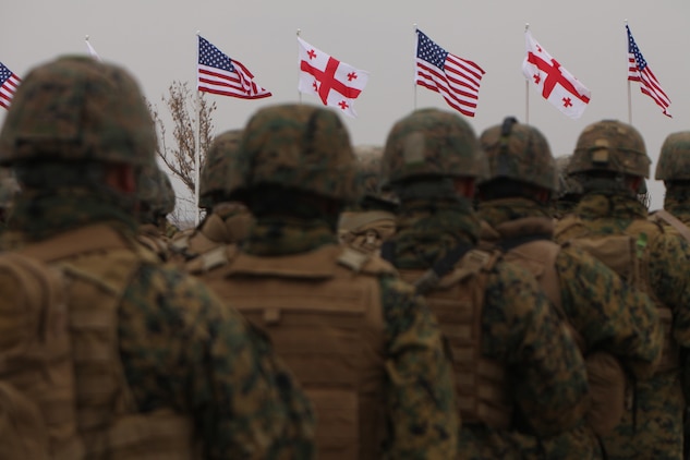 Marines assigned to the Black Sea Rotational Force observe the national anthems of the United States of America and Georgia during the opening ceremony of Operation Agile Spirit on Vaziani Training Area in Georgia, March 12. The combined operation is designed.