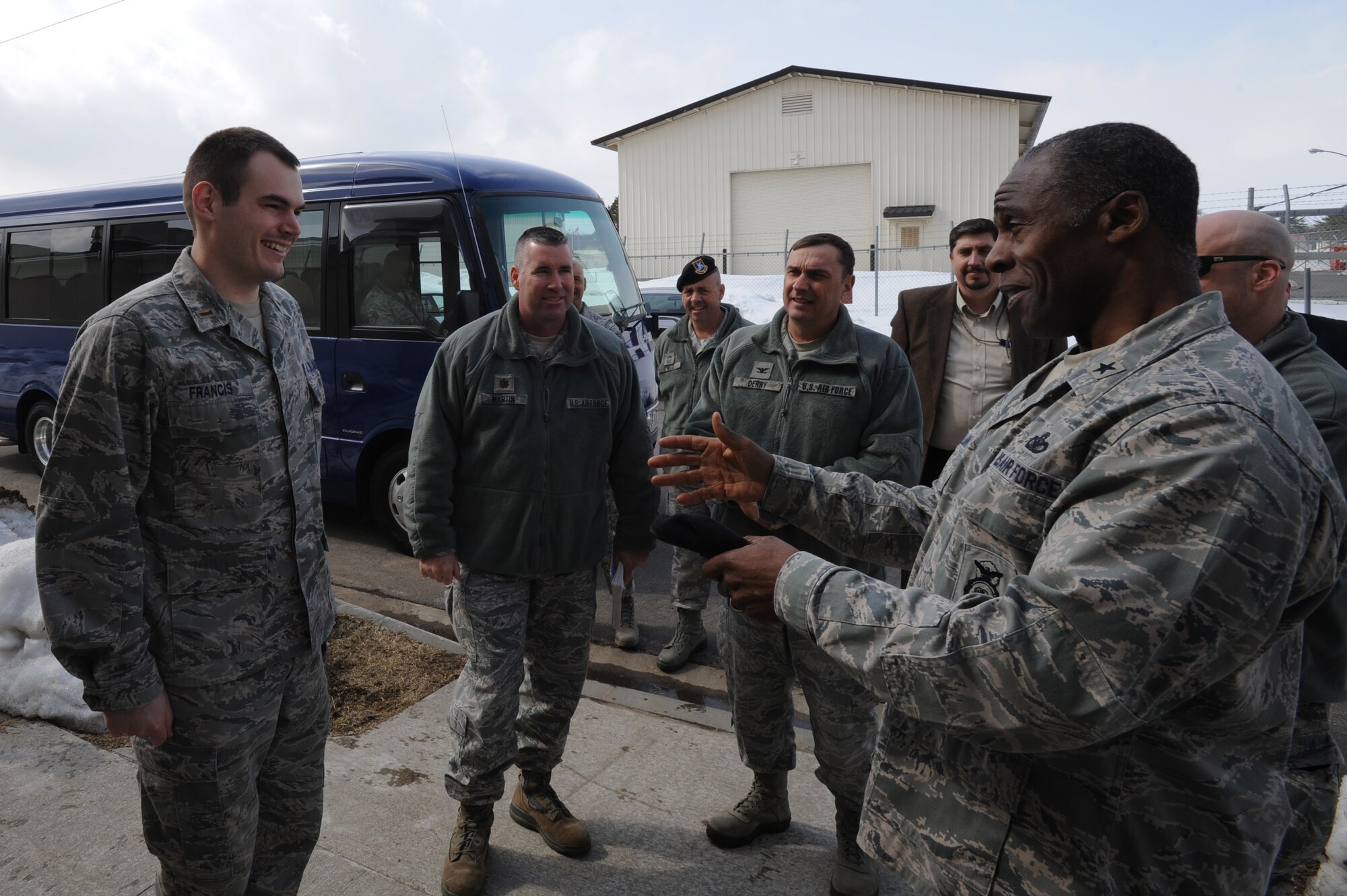 U.S. Air Force Brig. Gen. Jimmy McMillian, Air Force director of Security Forces, congratulates 2nd Lt. Austin Francis, left, 35th Fighter Wing Contracting Squadron, for his leadership role during the renovations of the 35th Security Forces Squadron combat arms shooting range at Misawa Air Base, Japan, March 9, 2012. McMillian visited the base to check on the moral and welfare of SFS Airmen. (U.S. Air Force photo by Airman Kenna Jackson/Released)