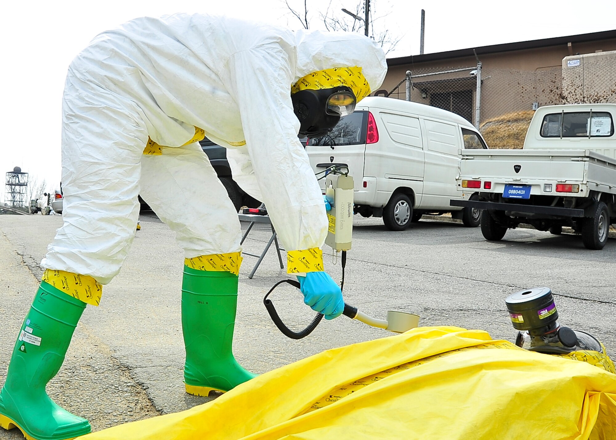 An Airman from the Emergency Management office scans a mannequin for radiological readings during an Emergency Management Exercise here, March 3, 2012. The exercise tests the base's capability to respond to a radiological incident.  (U.S. Air Force photo/Senior Airman Adam Grant)