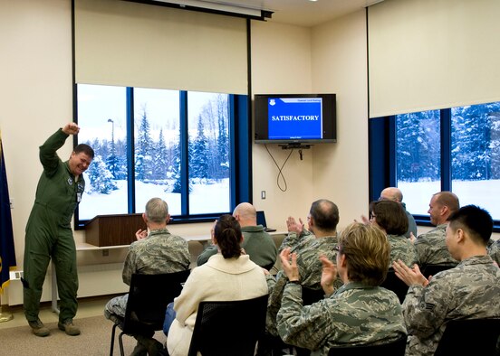 JOINT BASE ELMENDORF-RICHARDSON, Alaska - Col. Marcel Dionne, a team chief for the Air Force Inspection Agency, cheers with the announcement that the Alaska Air National Guard's 176 Medical Group passed their health services inspection here March 4, 2012.  

Health service inspections assess medical readiness, management effectiveness and quality of health-care delivery at all Air Force medical units. The 176 Medical Group received a rating of satisfactory indicating that they are carrying out their procedures and activities in an effective and competent manner. National Guard photo by Master Sgt Shannon Oleson
