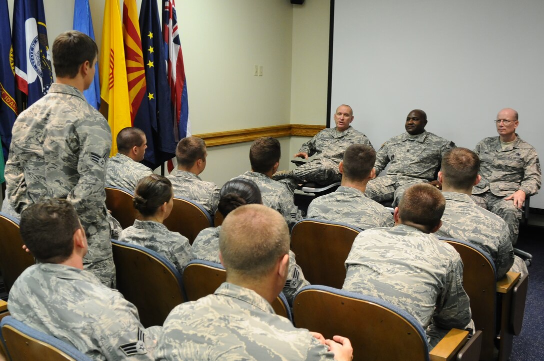 ANDERSEN AIR FORCE BASE, Guam- A Class 12-C Airman from the Airman Leadership School stands to ask a question to the Senior Enlisted Leaders during a panel, Mar. 8. The panel allows new and upcoming staff sergeants to ask questions on leadership and current events in order to prepare them in becoming staff sergeants. (U.S. Air Force photo/Senior Airman Carlin Leslie)