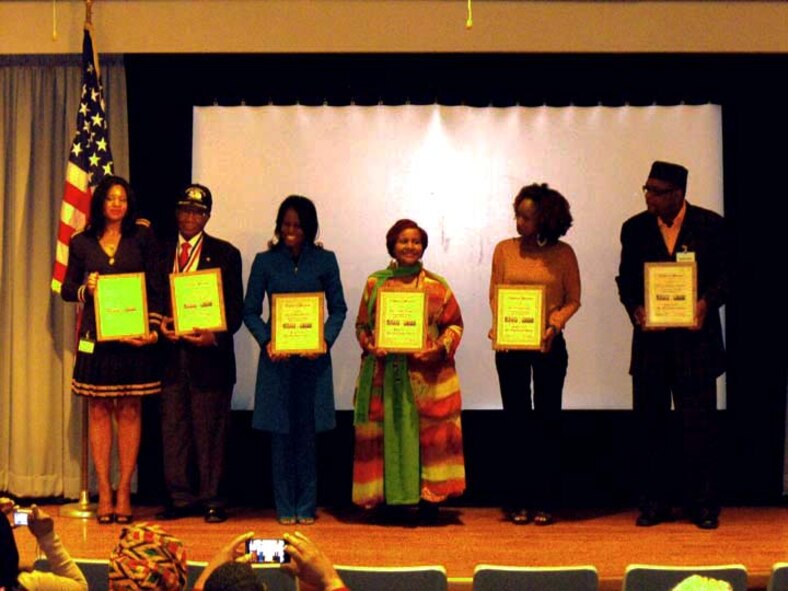 from left: Deanna Michaux, president and CEO, Pitbull Energy Products; Buford A. Johnson, retired U.S. Air Force crew chief and member of the Buford A. Johnson (CA) Chapter of Tuskegee Airmen, Inc.; Larita Shelby, president, Shall Be Music and Media and former American Forces broadcaster; Linda Wright, president, Moreno Valley Black Chamber of Commerce; Felicia Early, graduate, Tuskegee University; Bishop Randy Triplett, Victory Temple of Deliverance, Moreno Valley, who were guest
speakers at the Defense Media Center's Black History Month luncheon receive their awards of appreciation. (Photo by Navy Mass Communication Specialist Seaman William S. Gaskill)