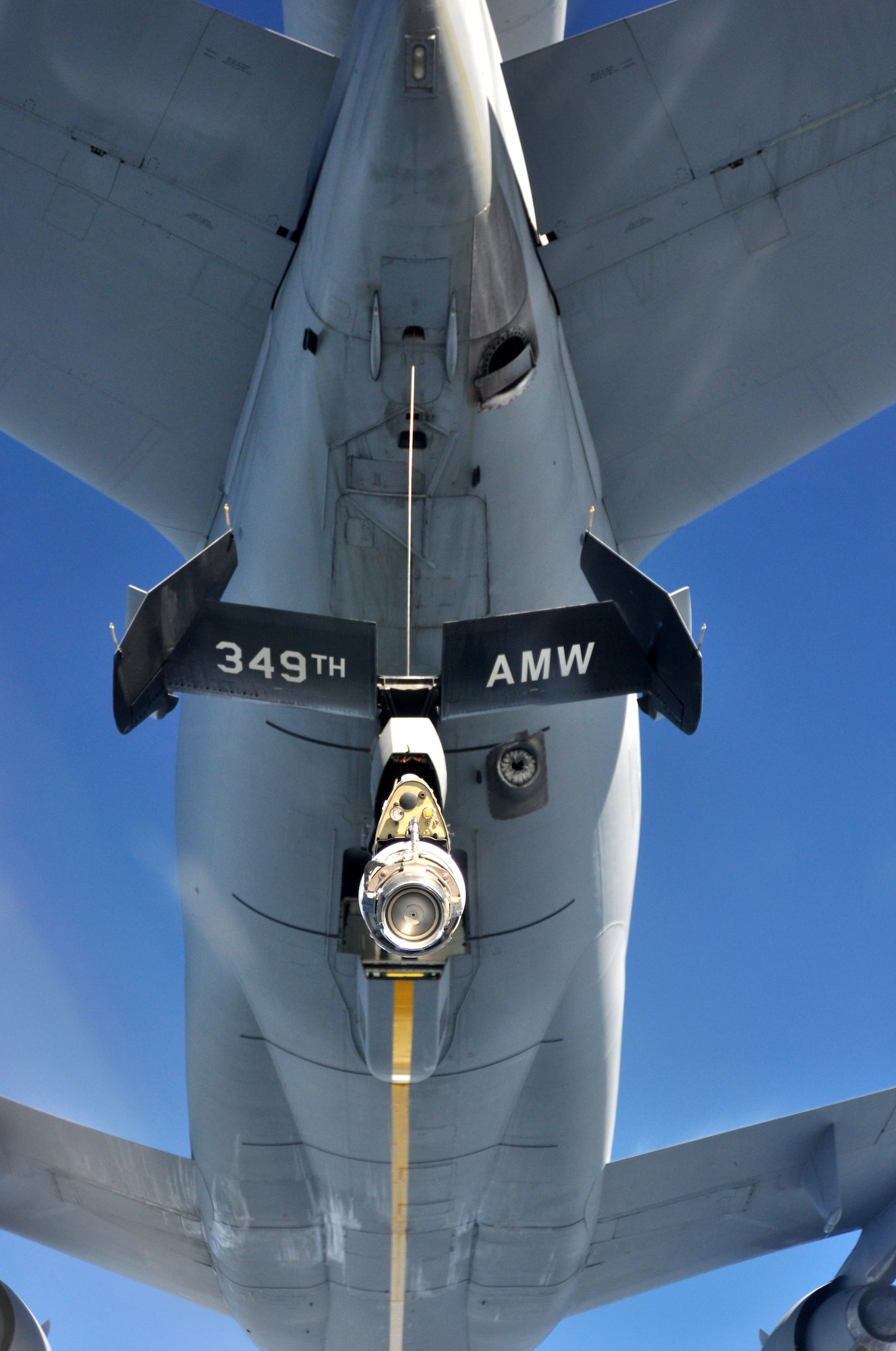An aircrew from the 62nd Airlift Wing approaches a KC-10 Extender from the 349th Air Mobility Wing at Travis Air Force Base, Calif., to begin aerial refueling during a local training mission March 8, 2012, above Yakima Training Center, Wash. The KC-10's boom operator controls refueling operations through a digital, fly-by wire system. During boom refueling operations, fuel is transferred to the receiver at a maximum rate of 1,100 gallons per minute. (U.S. Air Force photo/Airman 1st Class Leah Young)