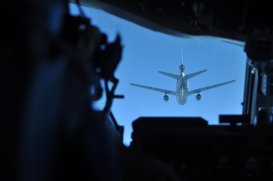 Capt. Michael Bargiel, 8th Airlift Squadron pilot, approaches a KC-10 Extender from the 349th Air Mobility Wing at Travis Air Force Base, Calif., to begin aerial refueling during a local training mission March 8, 2012, above Yakima Training Center, Wash. Although the KC-10's primary mission is aerial refueling, it can combine the tasks of a tanker and cargo aircraft by refueling fighters and simultaneously carry the fighter support personnel and equipment on overseas deployments. (U.S. Air Force photo by Airman 1st Class Leah Young/Released)