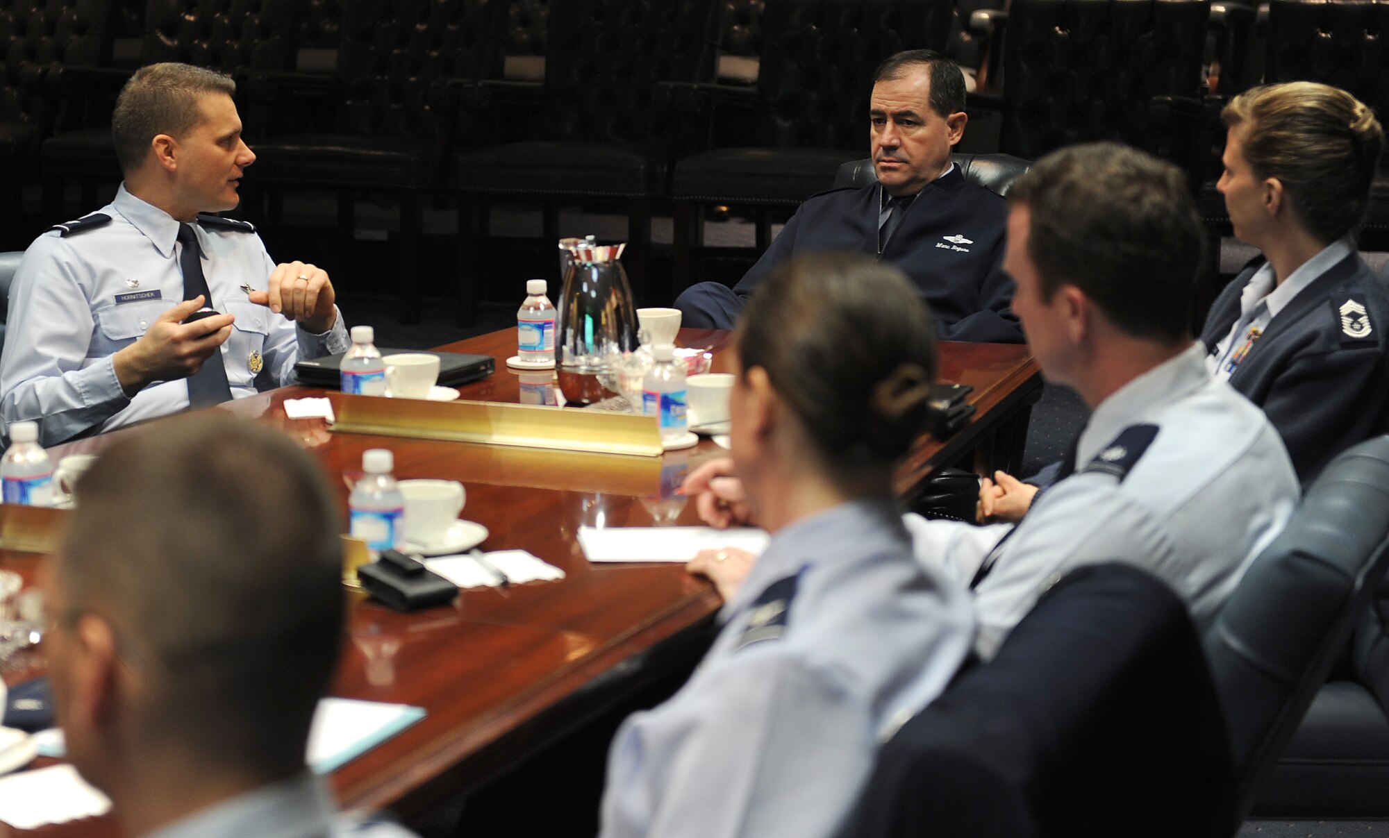 Col. Michael Hornitschek, 375th Air Mobility Wing commander, briefs Lt. Gen. Marc Rogers, Air Force inspector general, about the Scott Air Force Base mission Mar. 12.  Hornitschek, joined by senior leaders from the wing, helped explain Scott's "Enabling Combat Power" mission. (U.S. Air Force photo/Airman 1st Class Divine Cox)  