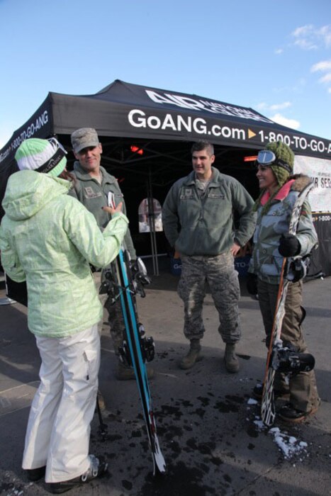 Utah Air National Guard recruiters Senior Master Sgt. Wayne Ormond (left) and Tech. Sgt. Spencer McWhorter work to find new recruits and create awareness of the ANG at the Sprint U.S. Snowboarding and Freeskiing Grand Prix at the Canyons Resort in Park City on Feb. 10, 2012. U.S. Air Force courtesy photo by Jake Ingle. (Released)