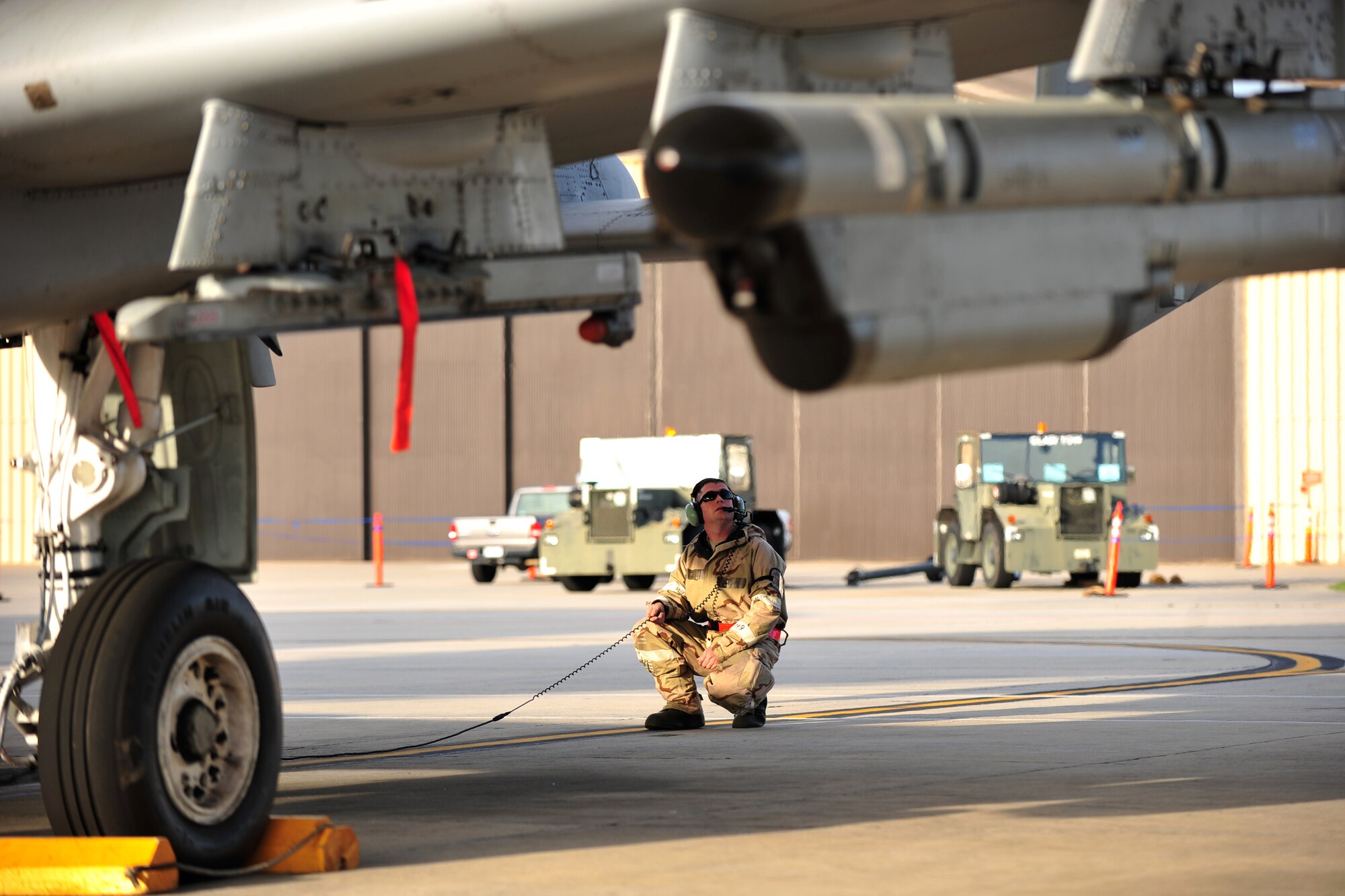 U.S. Air Force Staff Sgt. Michael Mindziak, 23d Aircraft Maintenance Squadron crew chief, performs a preflight inspection during a phase II operational readiness inspection at Moody Air Force Base, Ga., March 7, 2012. Crew chiefs ensure aircraft are ready to fly by performing preflight, post-flight, through flight, launch and recovery checks and resolve any discrepancies they may find. (U.S. Air Force photo by Staff Sgt. Stephanie Mancha/Released)
