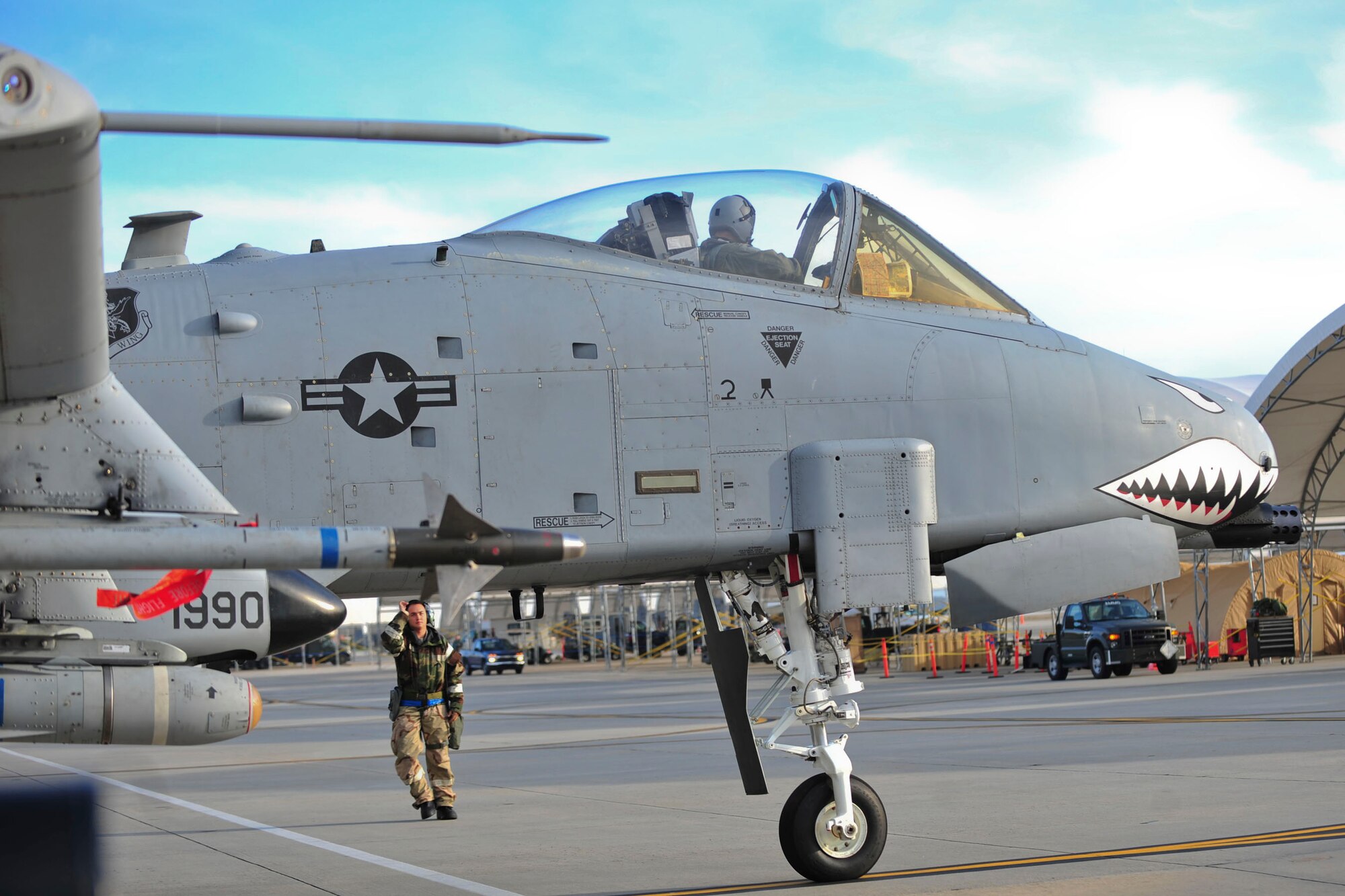 A U.S. Air Force crew chief with the 23d Aircraft Maintenance Squadron marshals an A-10C Thunderbolt II pilot during a phase II operational readiness exercise at Moody Air Force Base, Ga., March 7, 2012. OREs test the 23d Wing’s ability to meet wartime and contingency tasks and to survive and operate in a deployed location.  (U.S. Air Force photo by Staff Sgt. Stephanie Mancha/Released)
