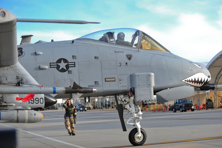 A U.S. Air Force crew chief with the 23d Aircraft Maintenance Squadron marshals an A-10C Thunderbolt II pilot during a phase II operational readiness exercise at Moody Air Force Base, Ga., March 7, 2012. OREs test the 23d Wing’s ability to meet wartime and contingency tasks and to survive and operate in a deployed location.  (U.S. Air Force photo by Staff Sgt. Stephanie Mancha/Released)
