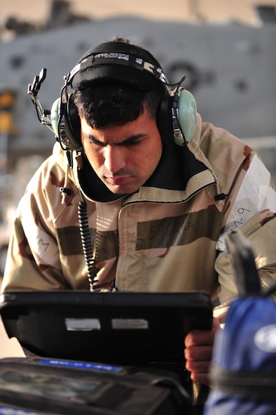 U.S. Air Force Airman 1st Class Hammad Gnazali, 23d Aircraft Maintenance Squadron specialist, checks computer data during a phase II operational readiness exercise at Moody Air Force Base, Ga., March 7, 2012. Aircraft specialists review data during preflight inspections of all aircraft to ensure they are mission ready. (U.S. Air Force photo by Staff Sgt. Stephanie Mancha/Released)
