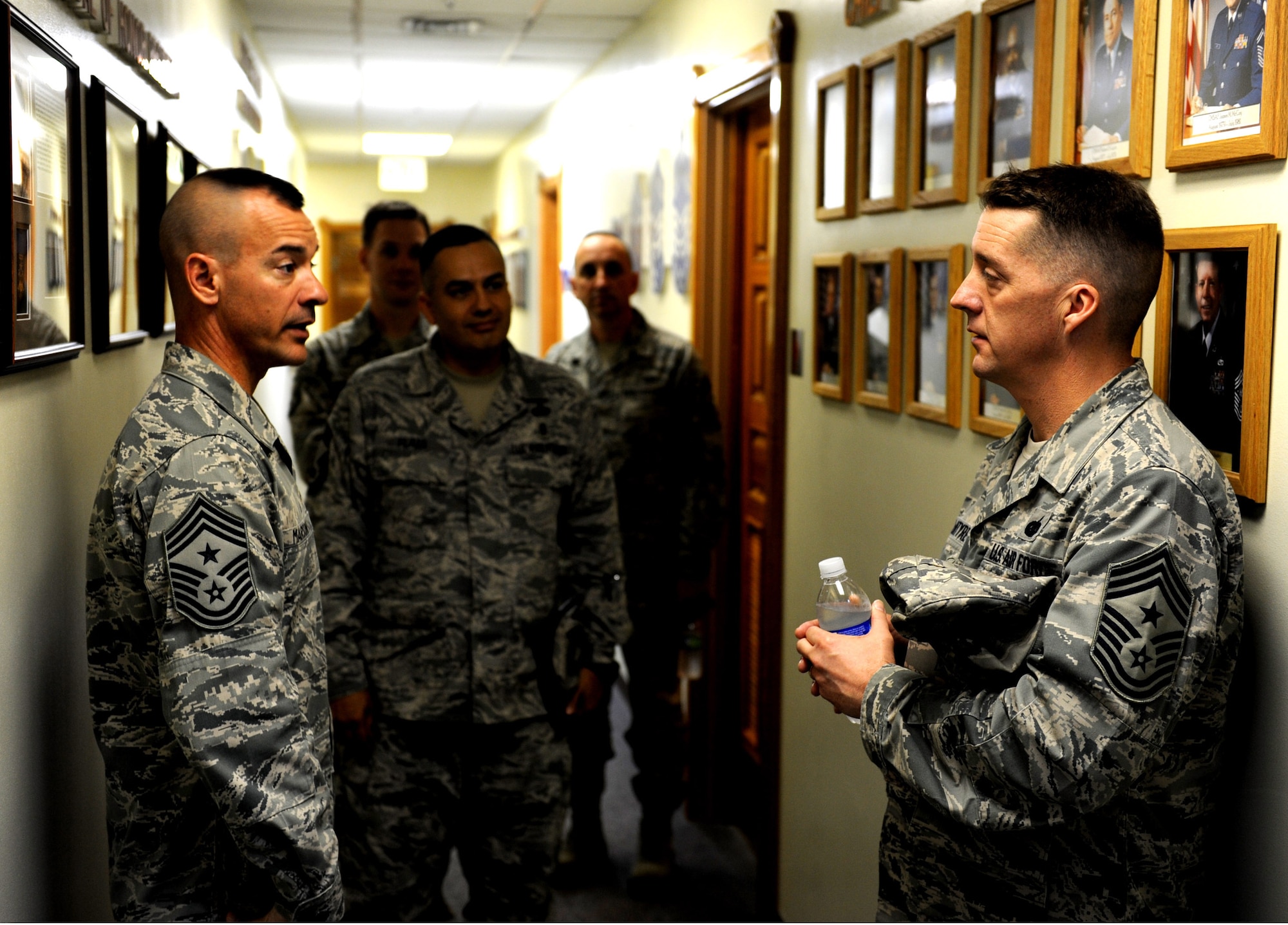 U.S. Air Force Chief Master Sgt. Mark Marson, 18th Wing command chief speaks with Chief Master Sgt. Douglas McIntyre, 5th Air Force command chief, during a tour of the McDaniel Center on Kadena Air Base, Japan, March 9, 2012. The 5th Air Force is the U.S. Air Force's oldest continuously serving Numbered Air Force. (U.S. Air Force photo by Airman 1st Class Justin Veazie/released)