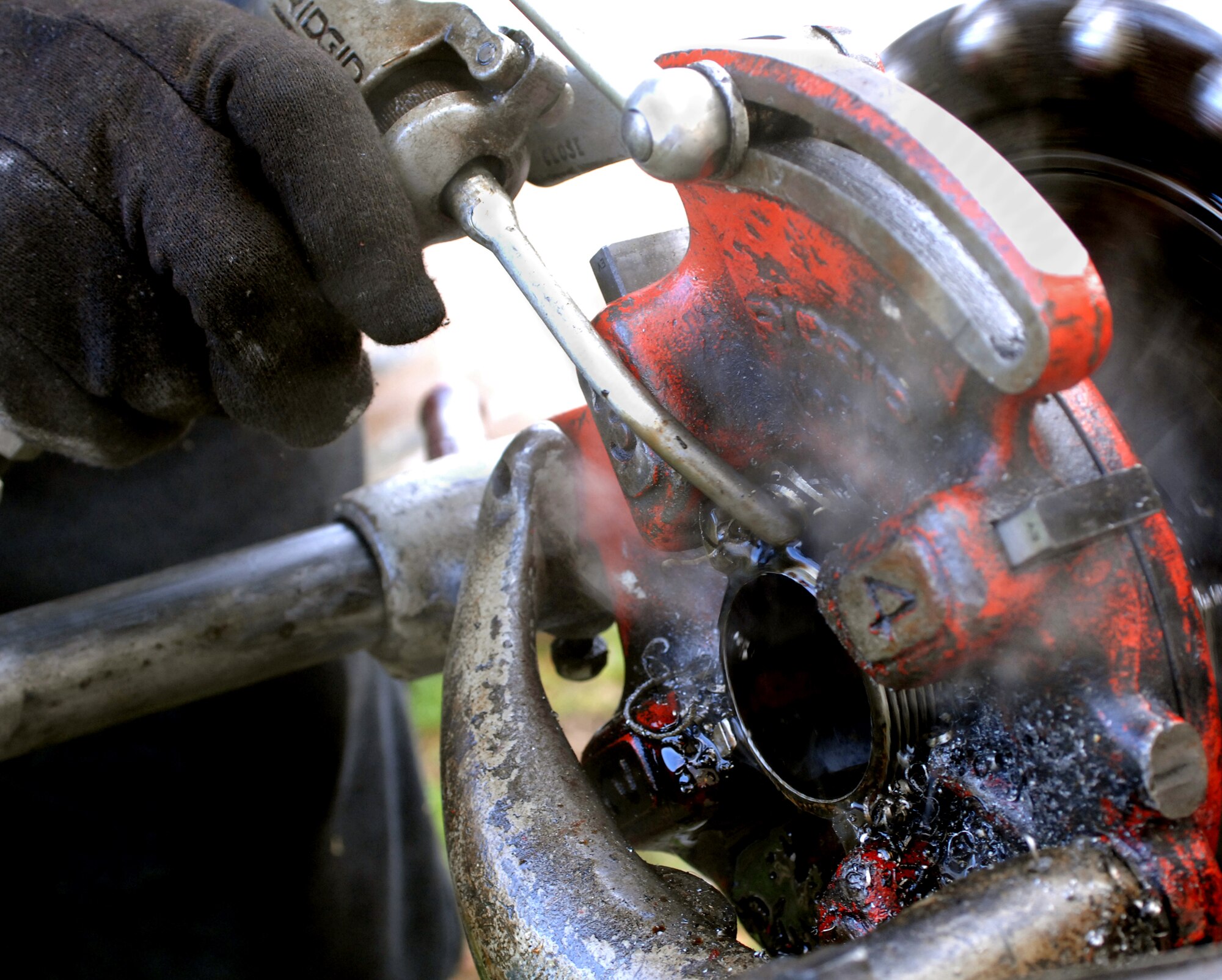 John Copes, Fire and Sprinkler Services superintendent, fabricates branch lines on Barksdale Air Force Base, La., March 12. Copes is adding threads to a branch line for a sprinkler system that is being installed on a new blast booth at the 2nd Maintenance Squadron Structural Maintenance Coating shop. (U.S. Air Force photo/Airman 1st Class Joseph A. Pagán Jr.)(RELEASED)